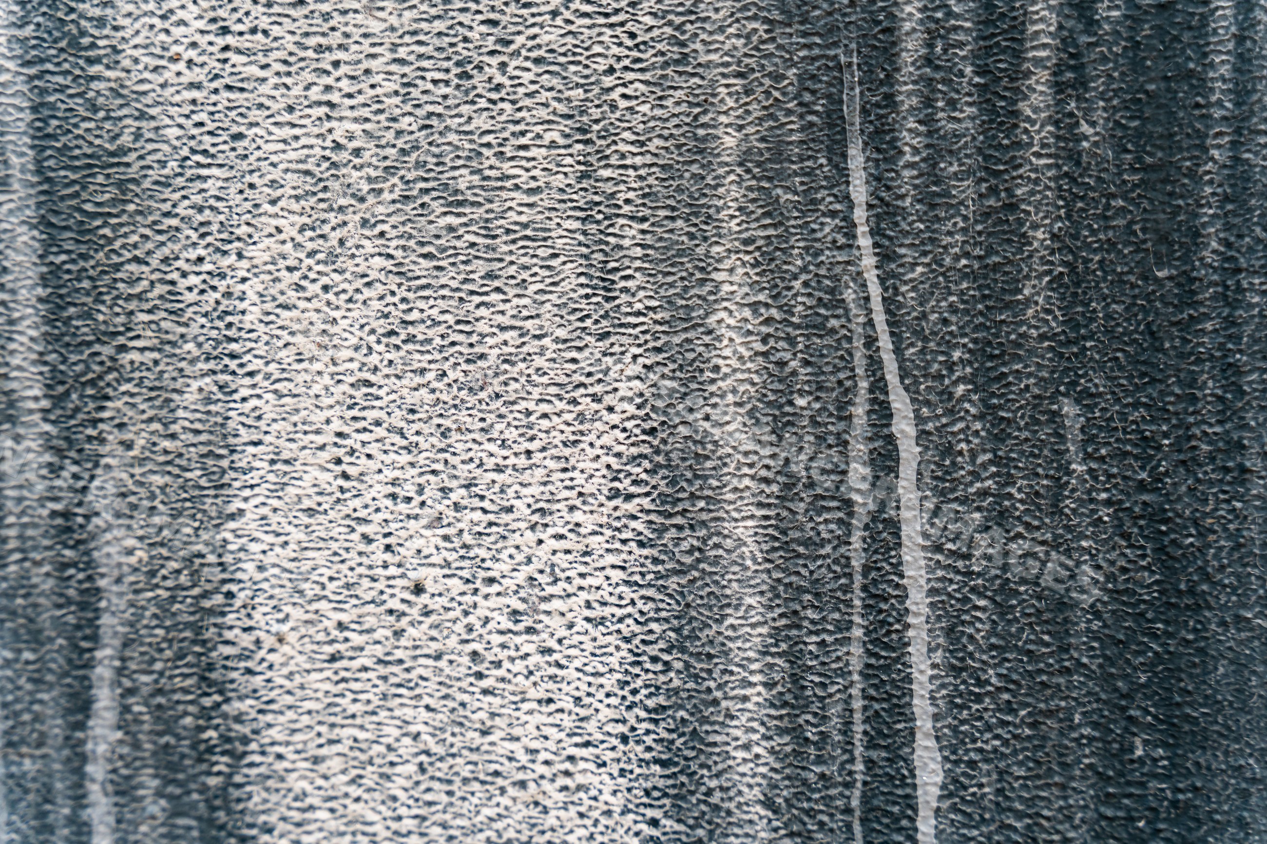 Textured black and white abstract surface with granular pattern
