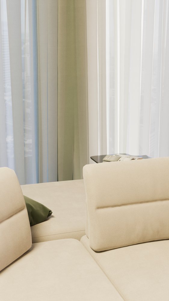 Modern living room with beige sofa, green cushion