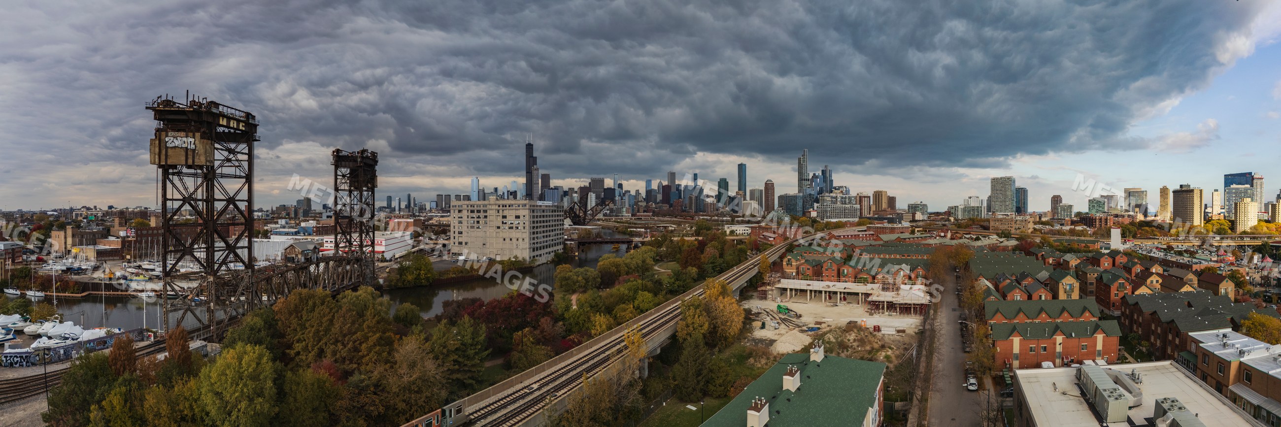 Canal Street Railway Bridge with chicago skyline under storm clouds