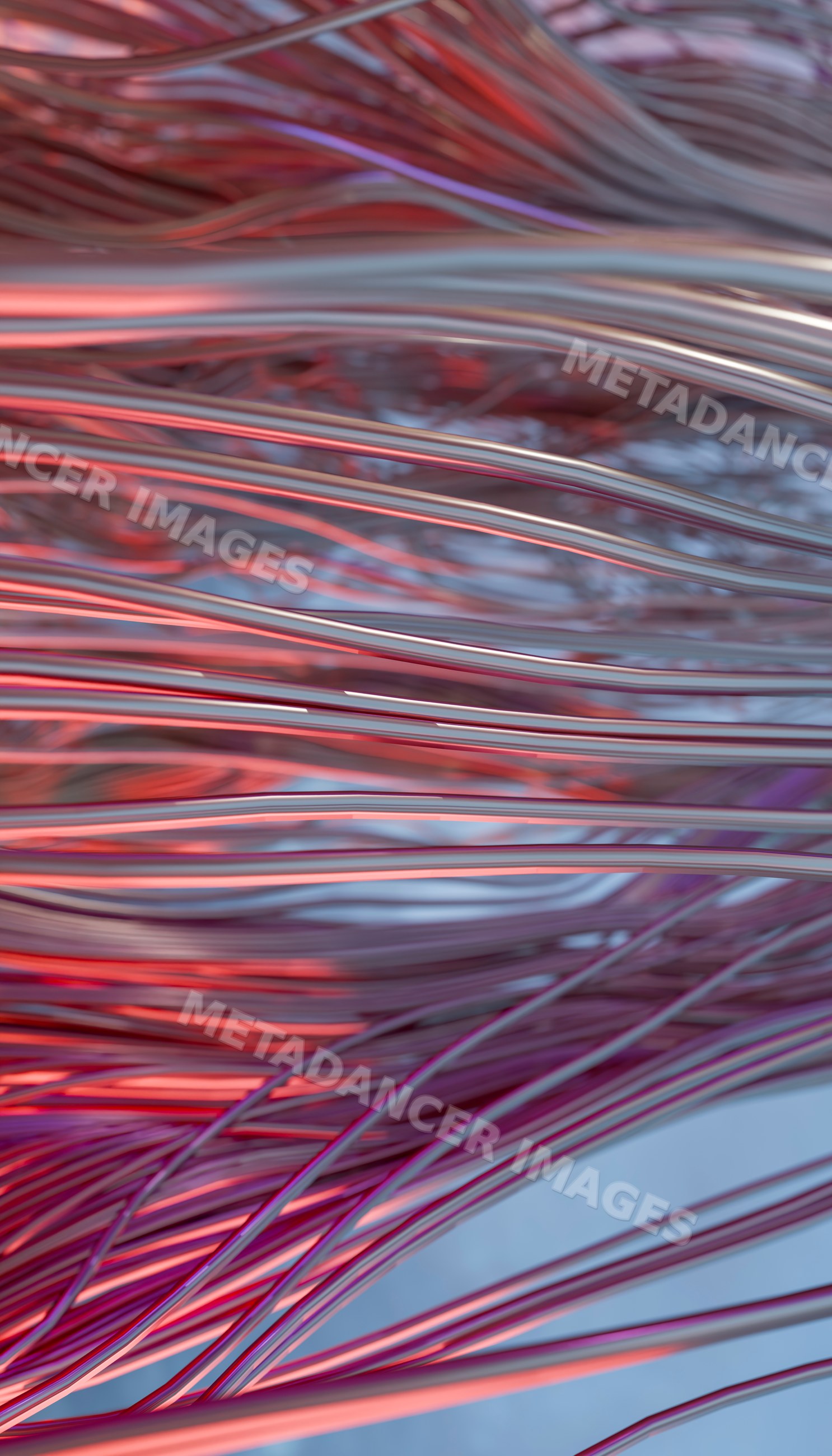 Close-up of twisting metallic wires with red and purple light