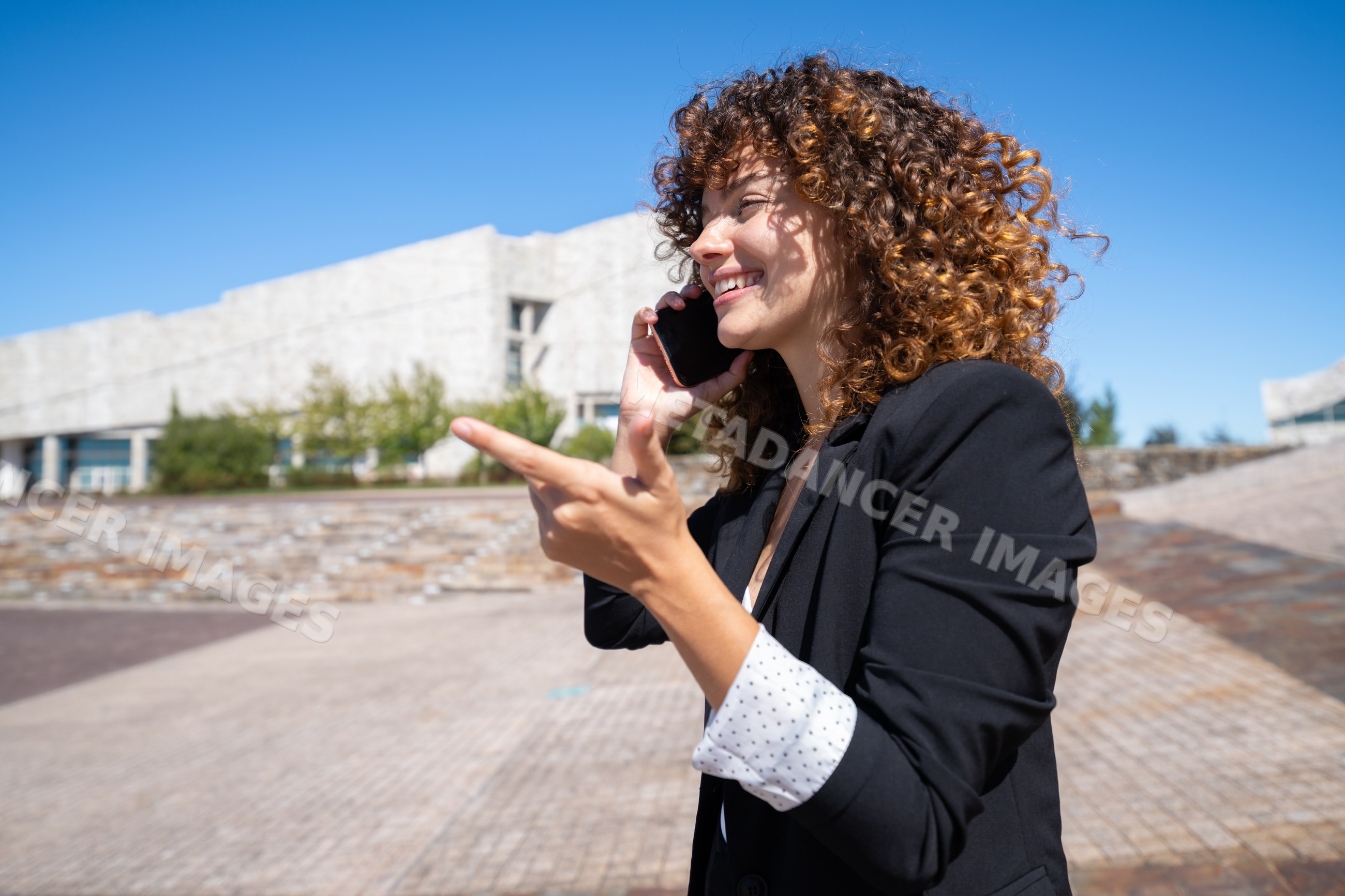 Businesswoman talking on phone outdoors