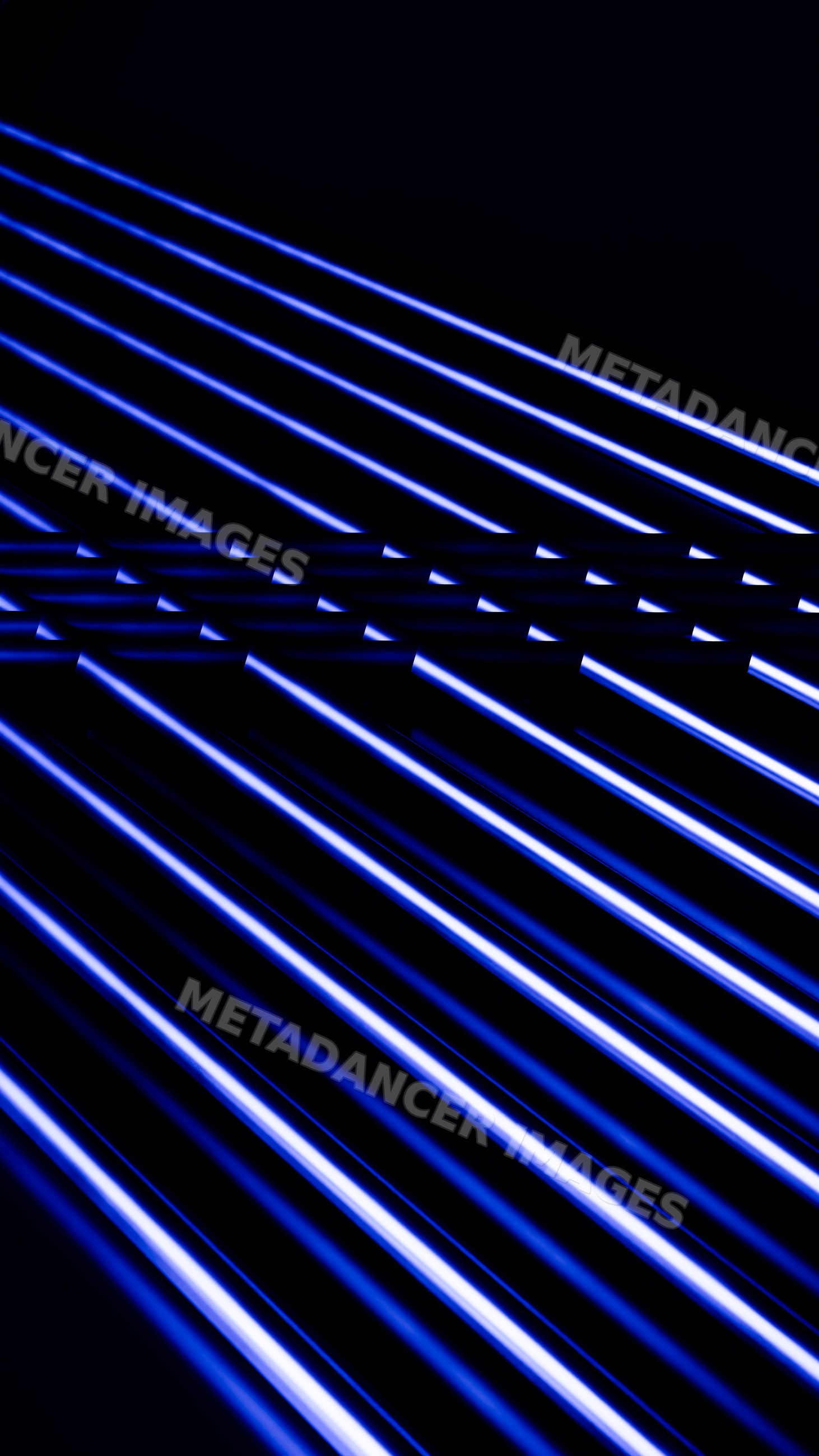 Blue neon light streaks on dark background