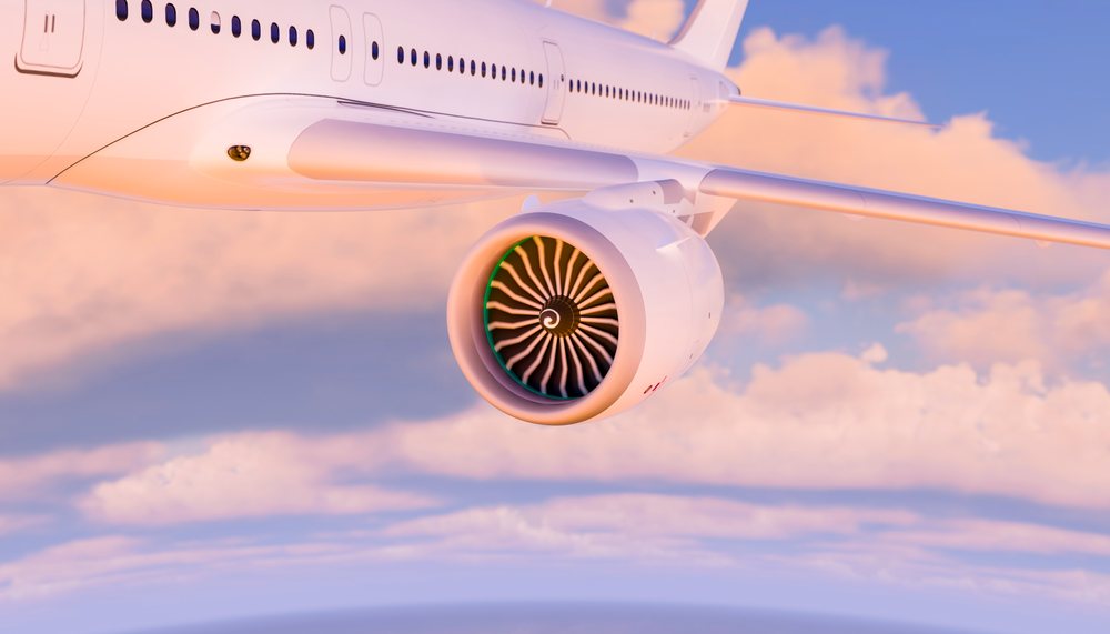 Close-up of an airplane turbine engine in flight through the sky
