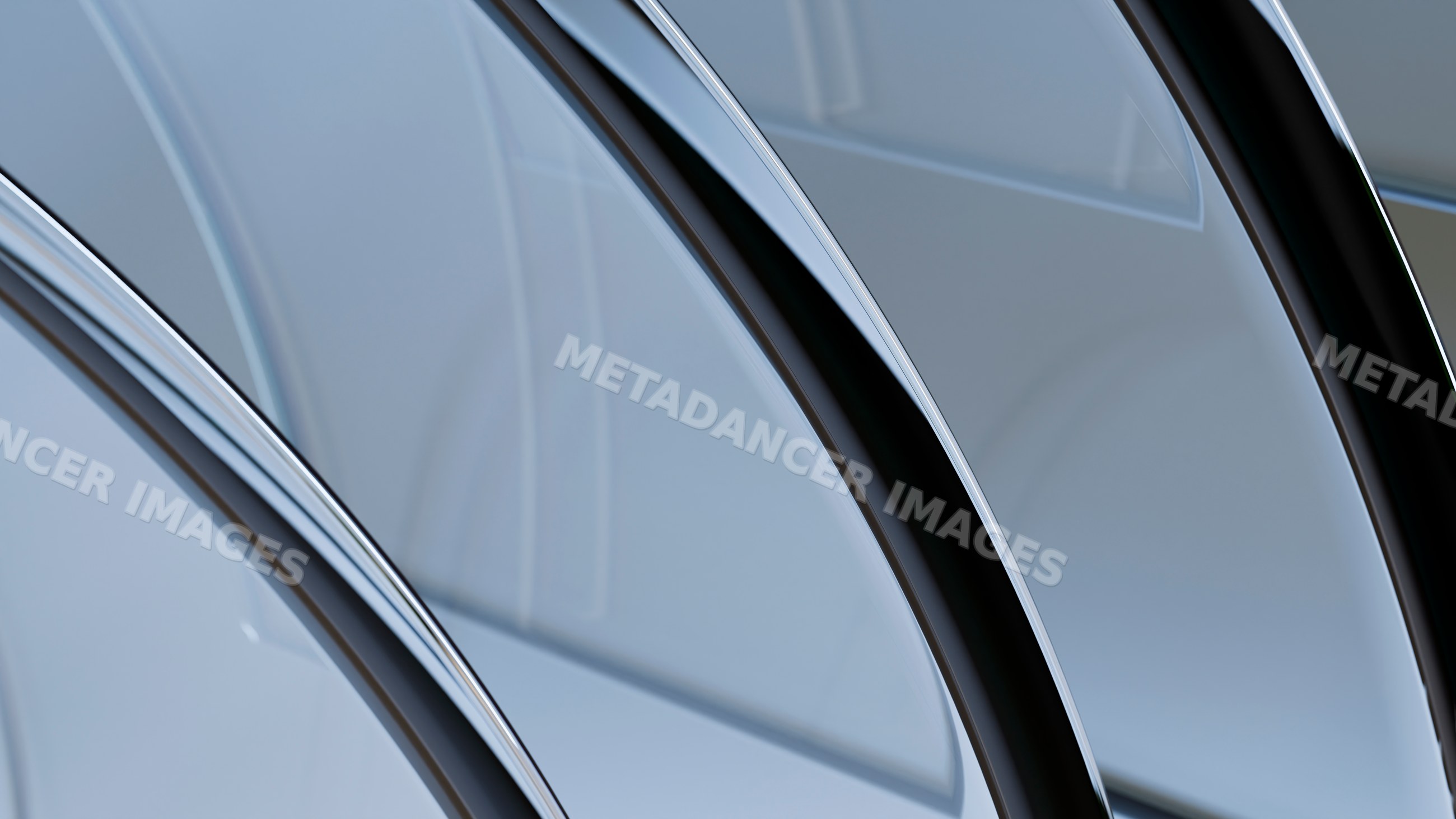 Close-up of curved chrome metal surfaces with abstract reflections