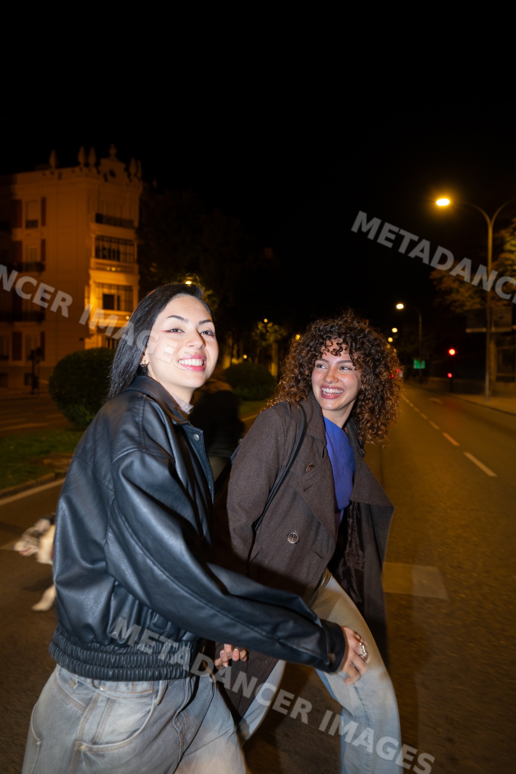 Two Hispanic and white women walking together on a Madrid street