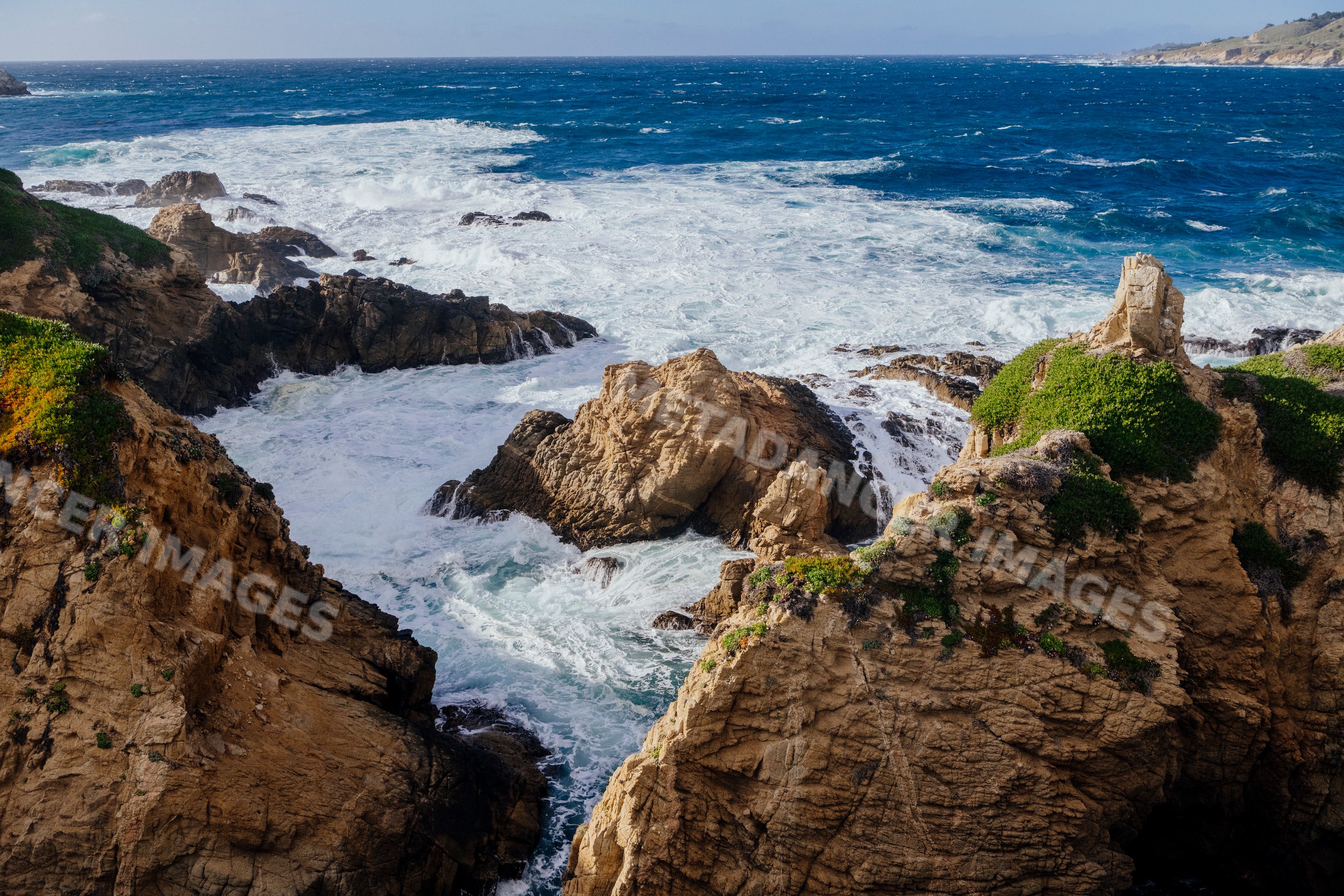 Rocky coastline with waves crashing on sea cliffs