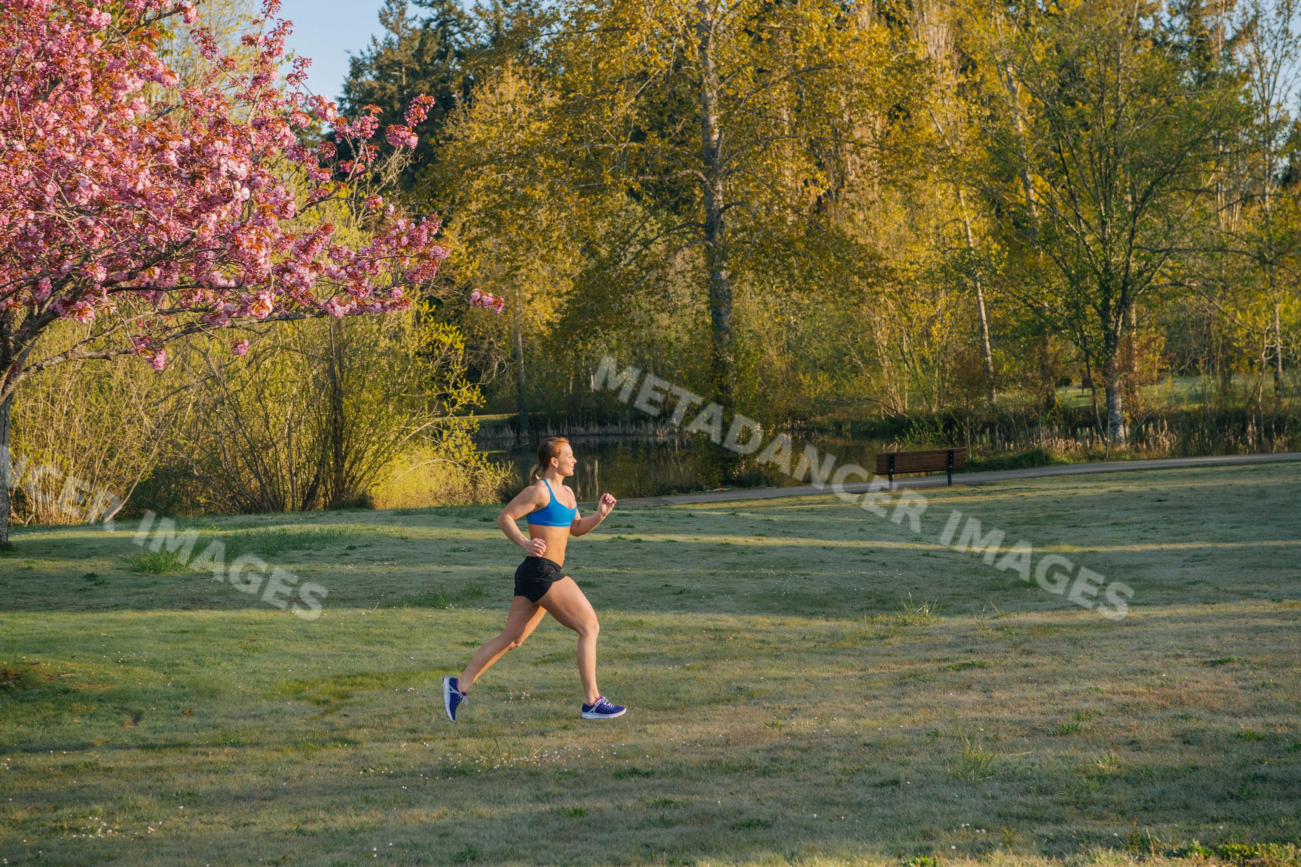 White runner jogging in park on bainbridge island in morning