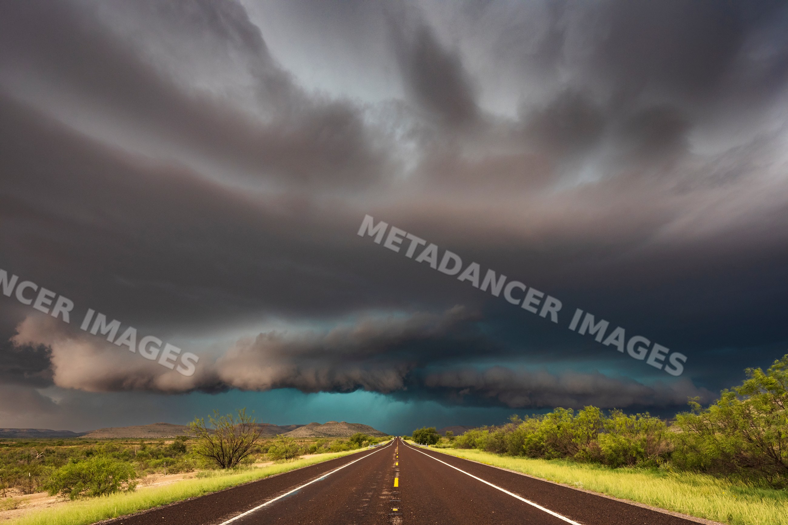 Storm cloud formation over road in texas Great Plains