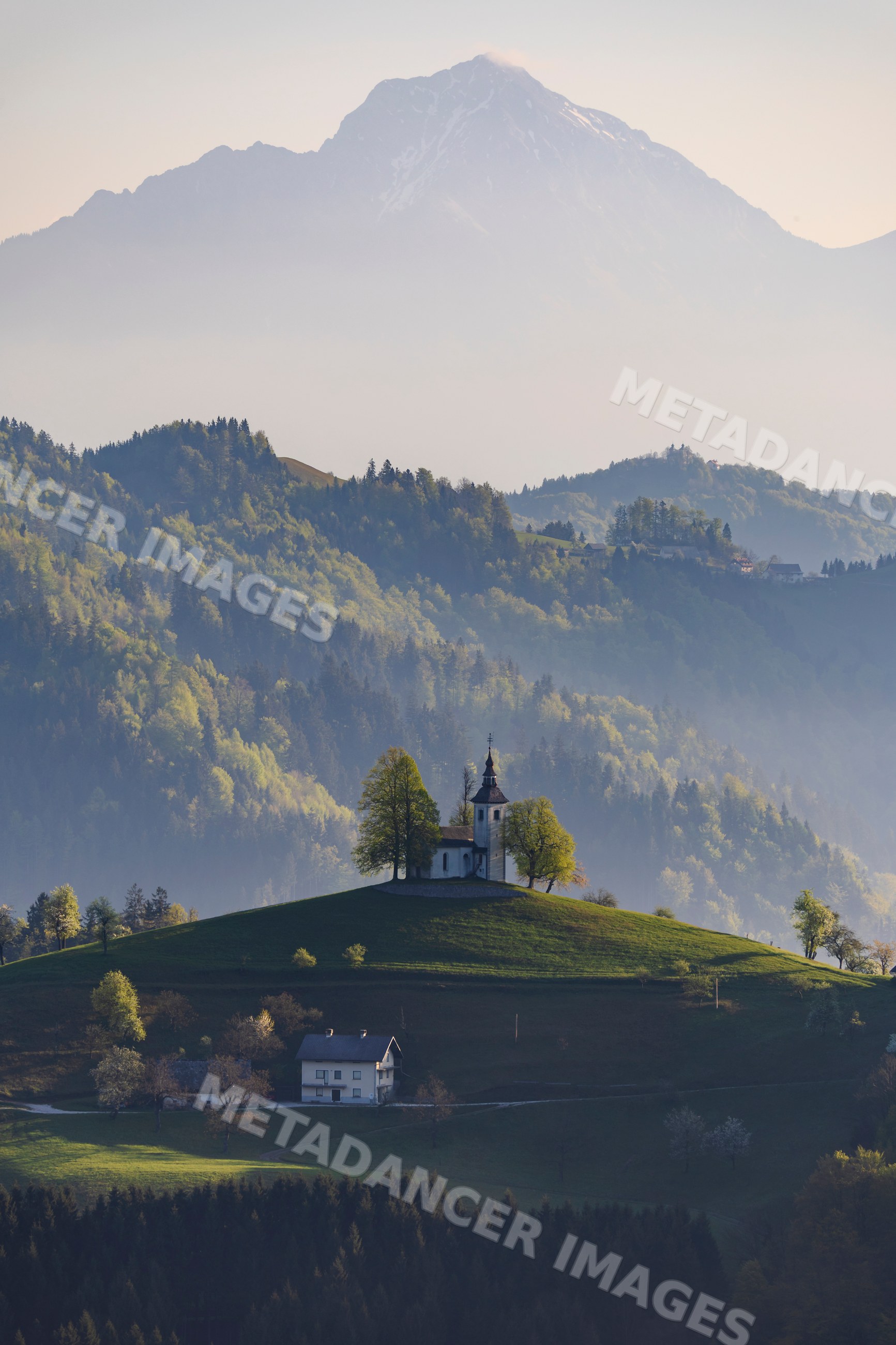 St thomas's Church on hilltop at Sunrise in škofja loka Slovenia