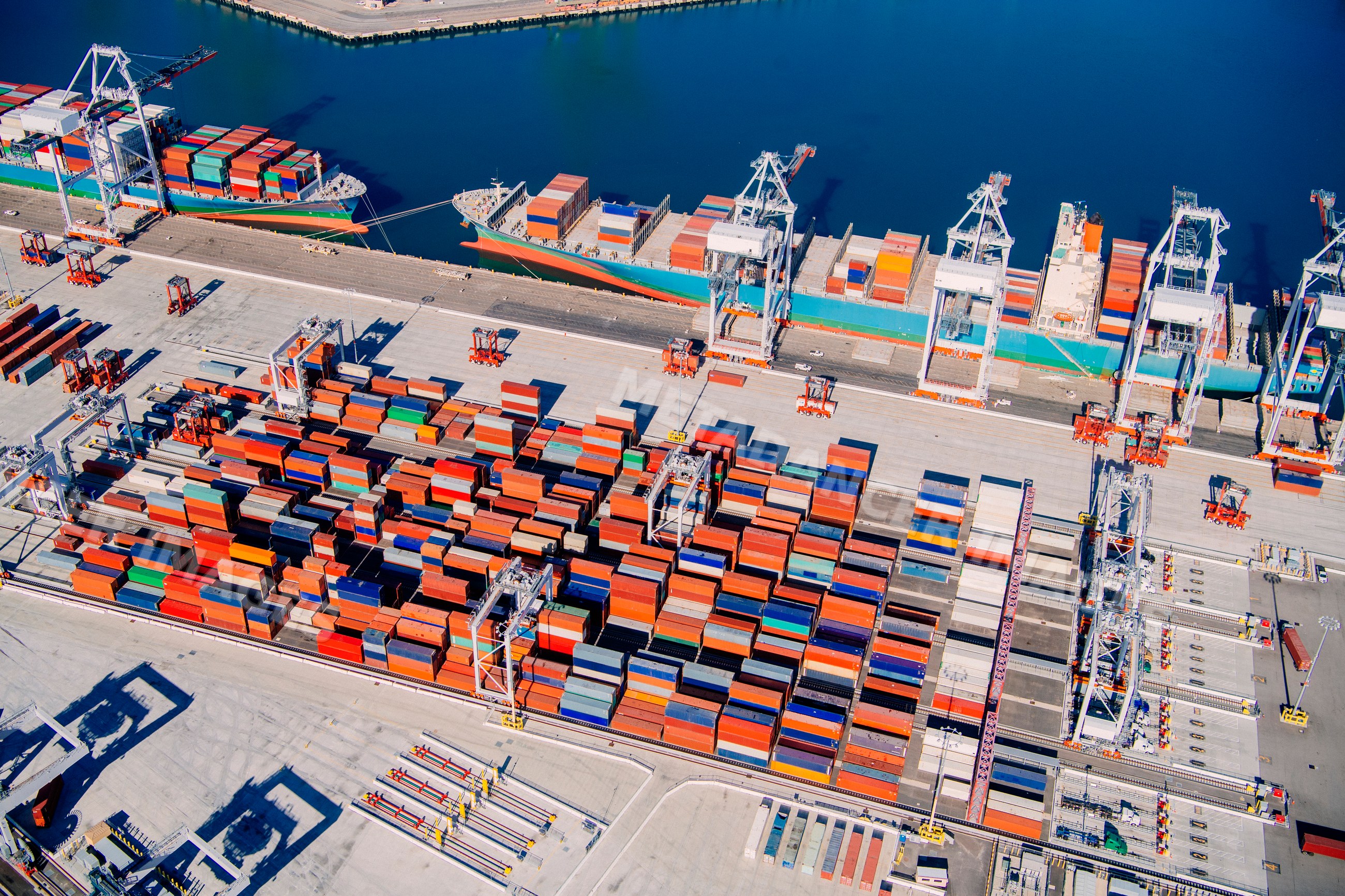 Container ship loading shipping containers at long beach port