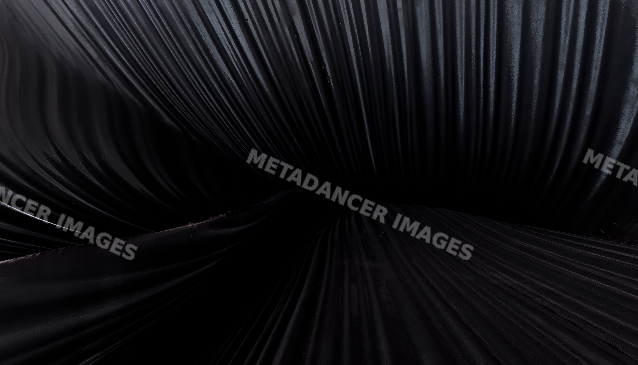 Black fabric with deep folds and smooth texture