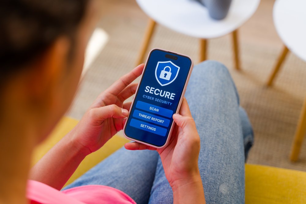 Hispanic Person using a cybersecurity application on a smartphone