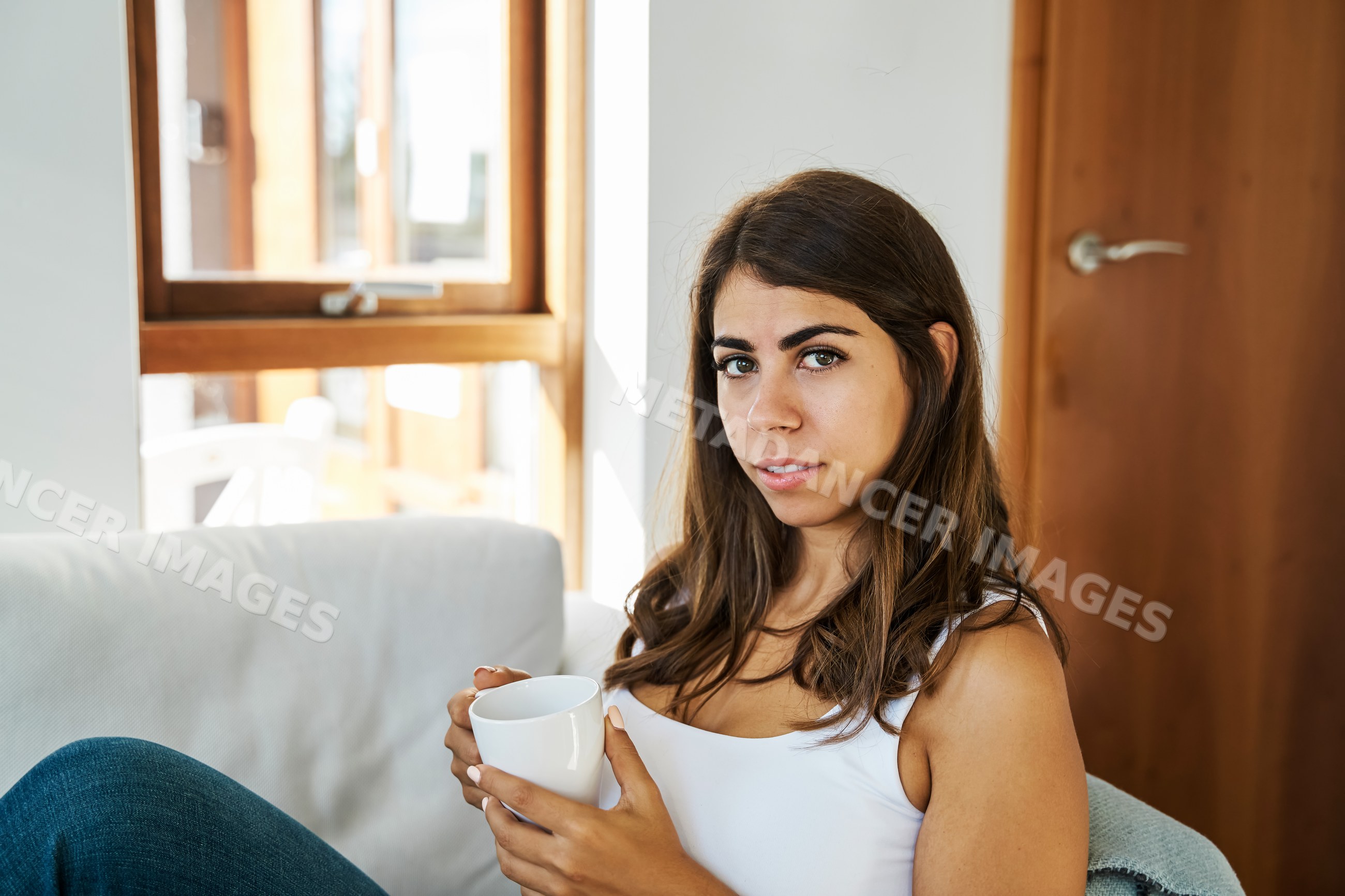 Young white woman holding a mug