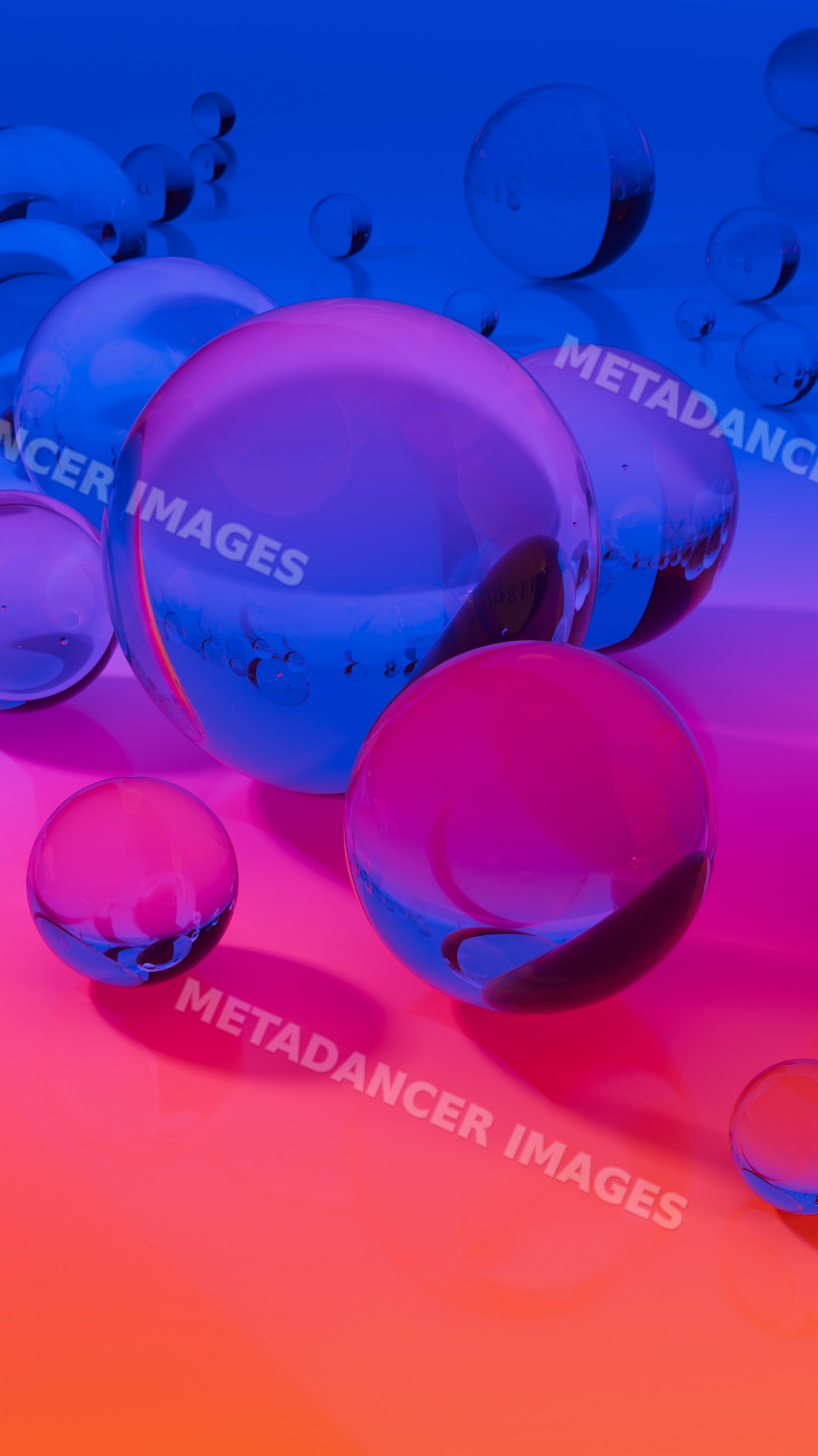 Cluster of transparent glass spheres with blue and pink reflections
