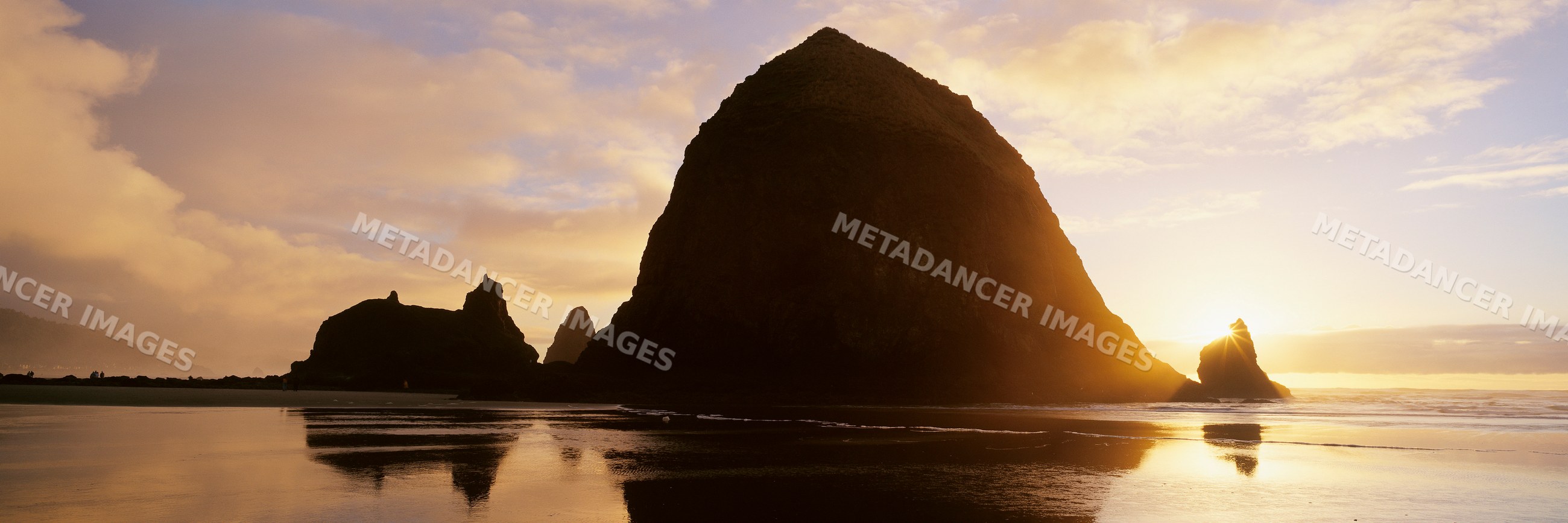 Haystack rock silhouette at sunset on cannon beach oregon coast