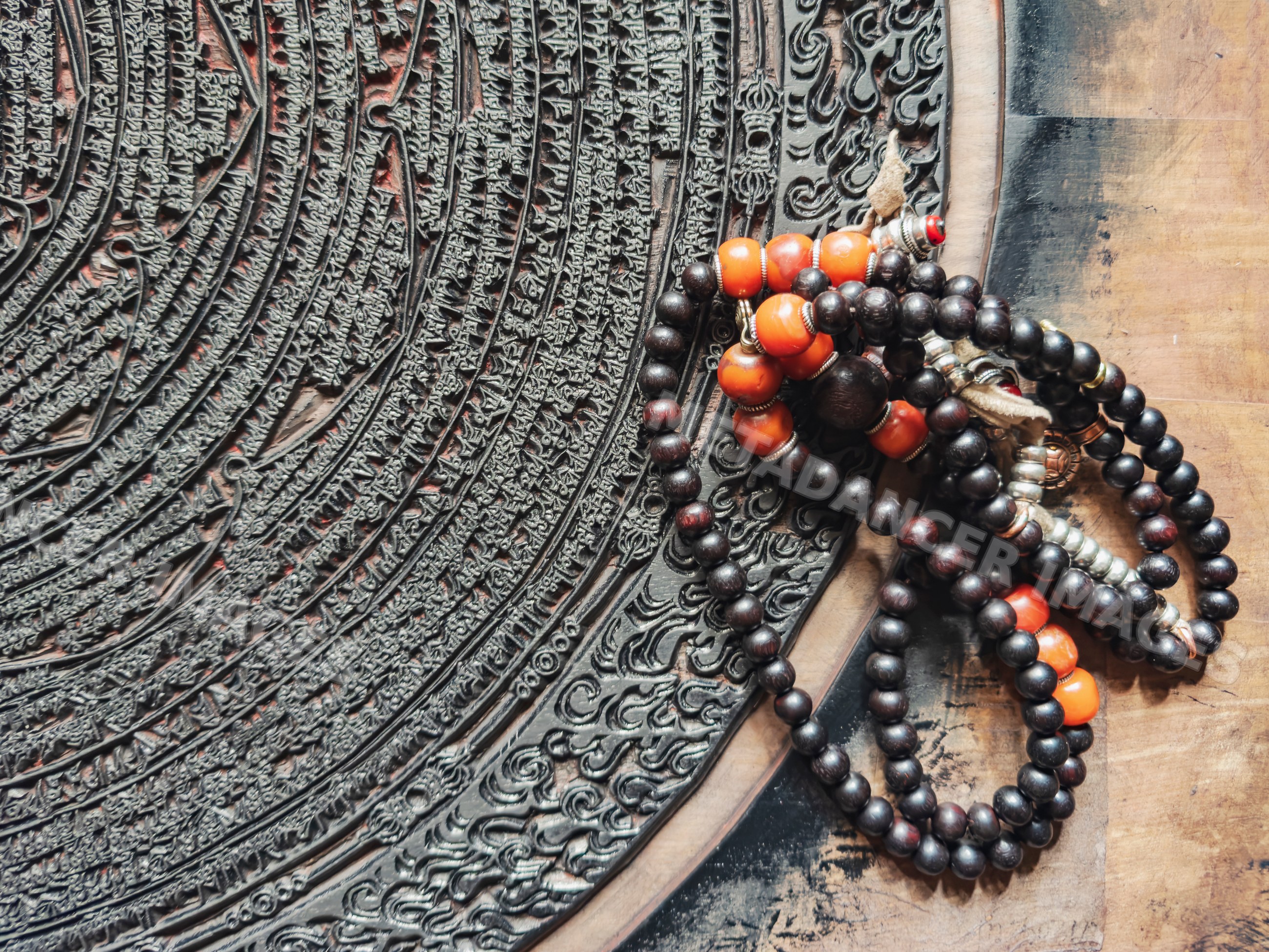 Intricately carved Corcular Printing Block with tibetan prayer beads