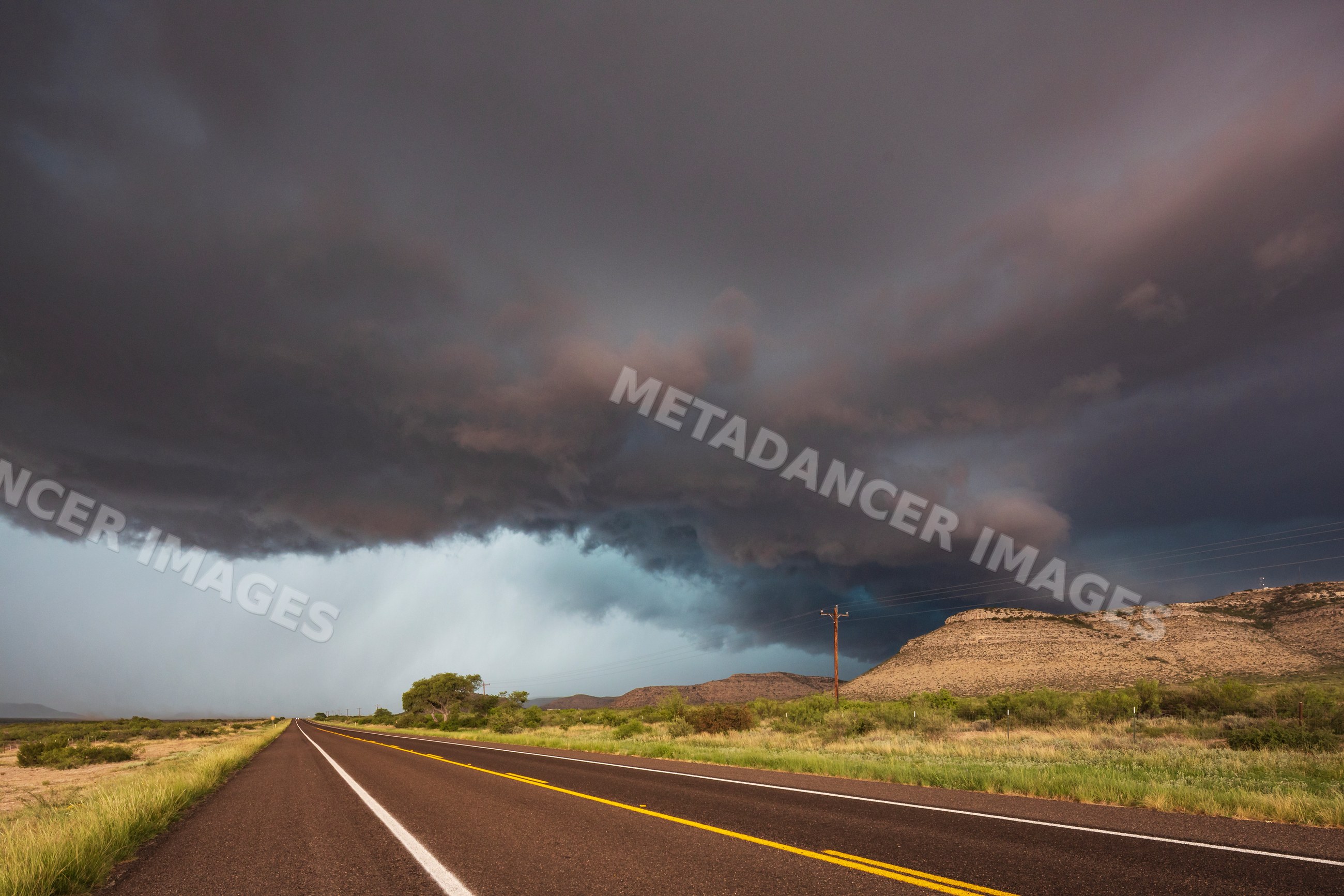 Storm clouds approaching along TX Highway 90 in sanderson texas