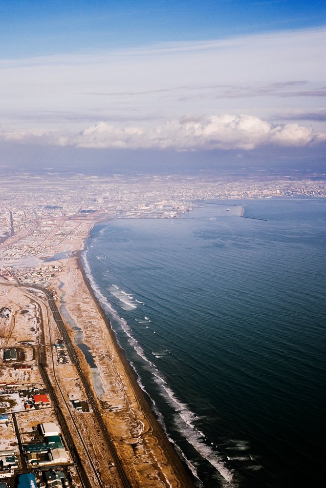 Aerial view of coastline and harbor, Japan