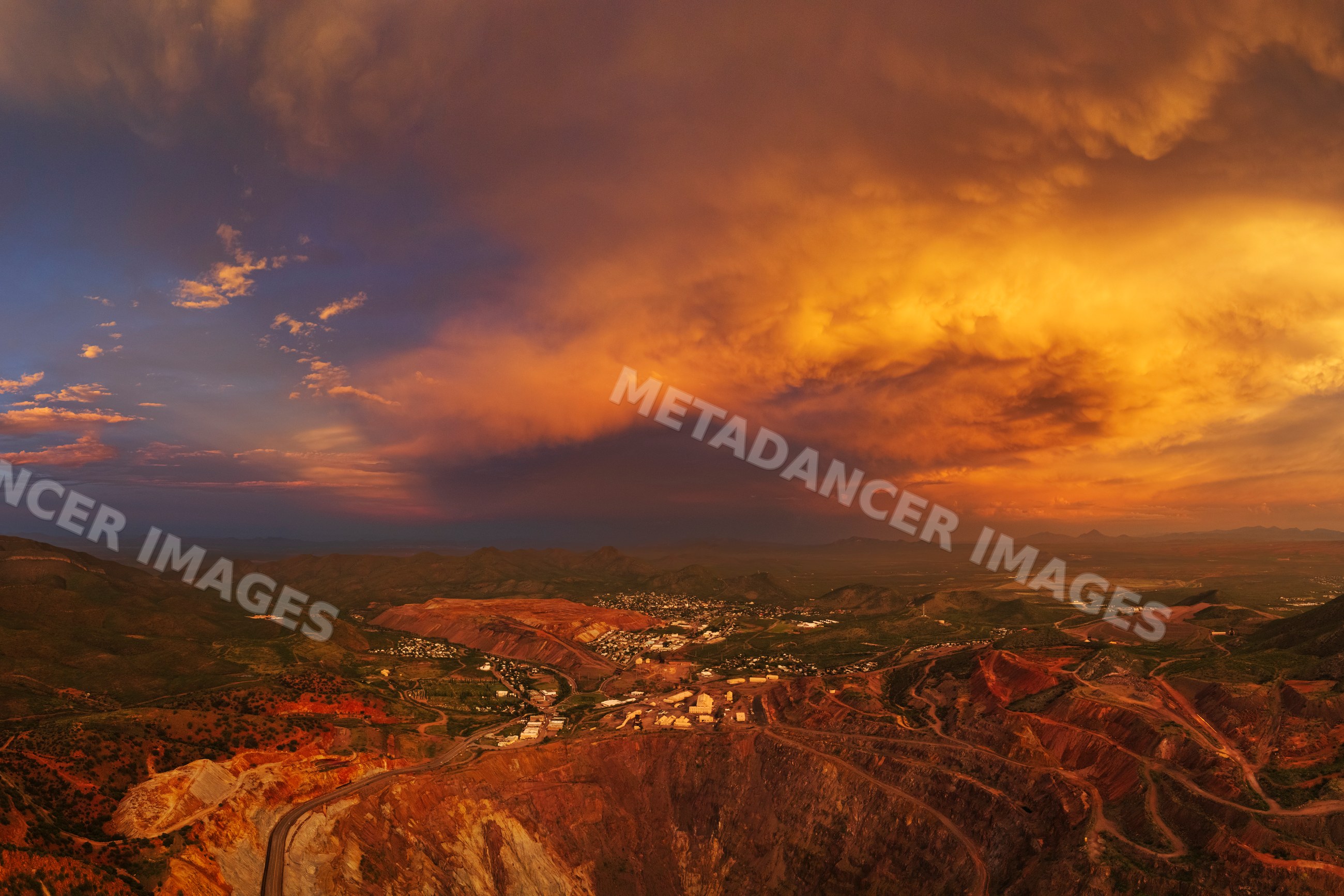 Bisbee copper mine open pit at dusk under stormy sky