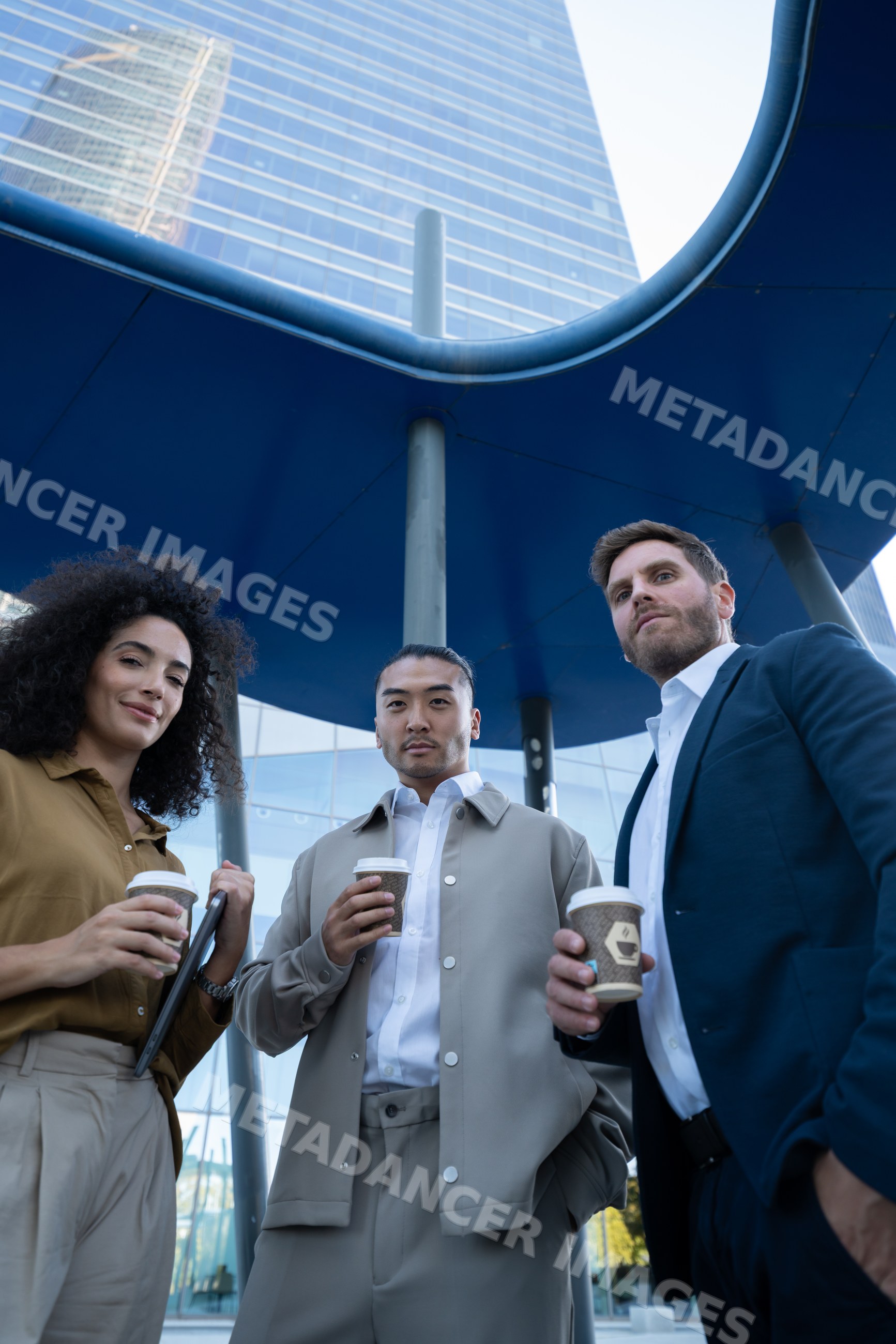 Businesspeople holding coffee cups