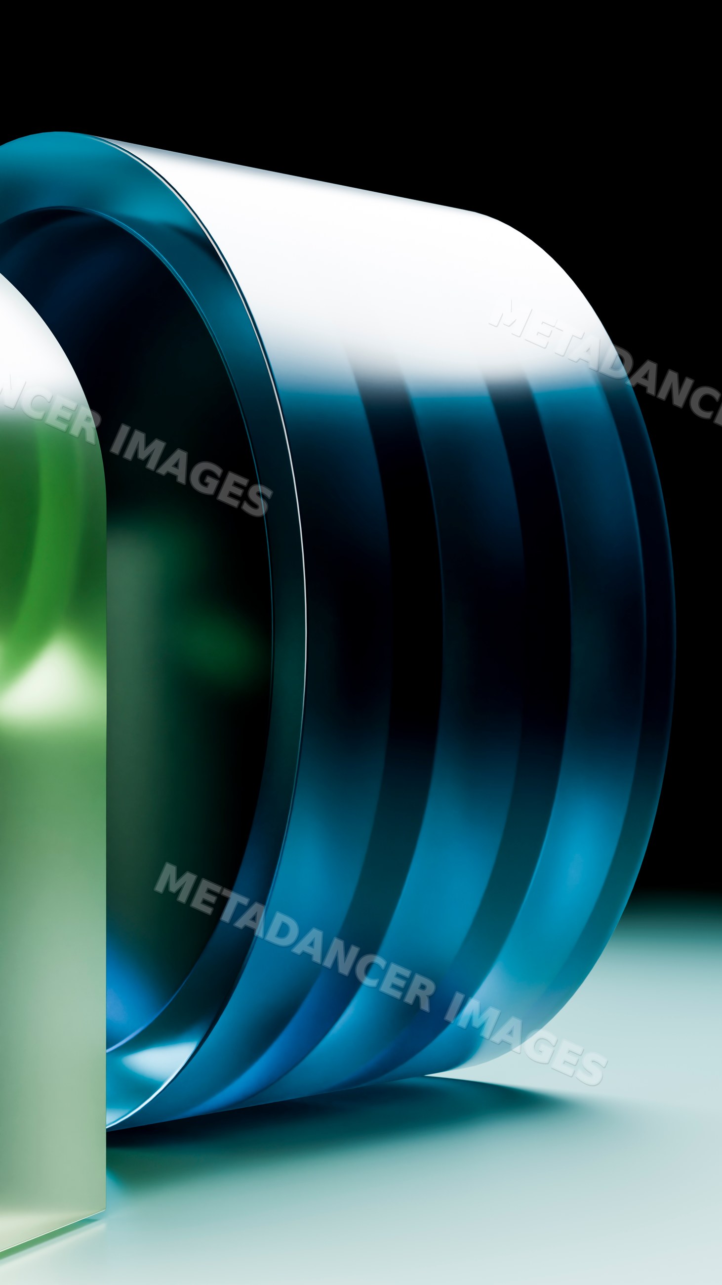 Modern blue and green curved glass sculpture with reflective surface