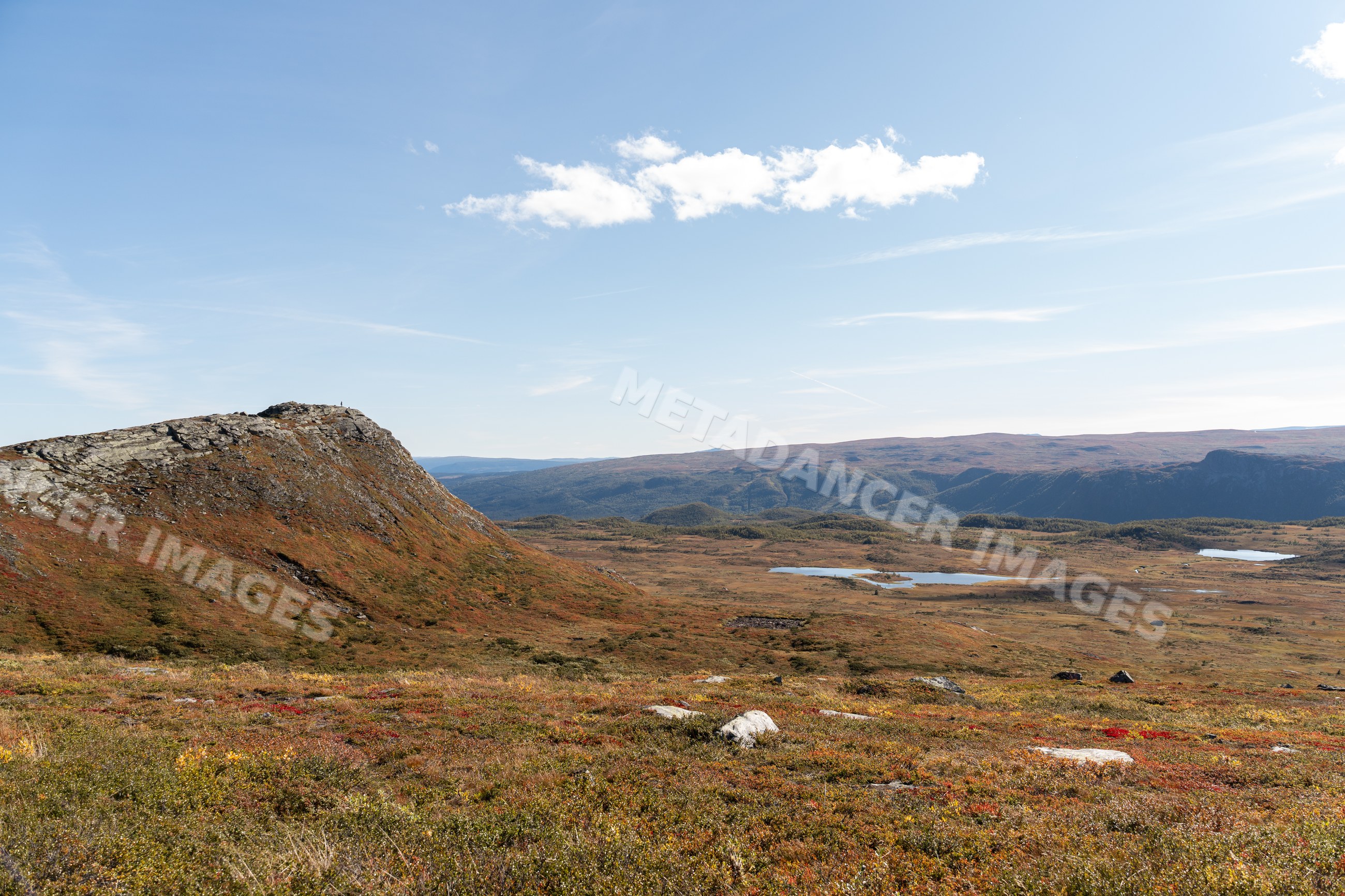 Rocky mountain and autumn tundra landscape with lakes