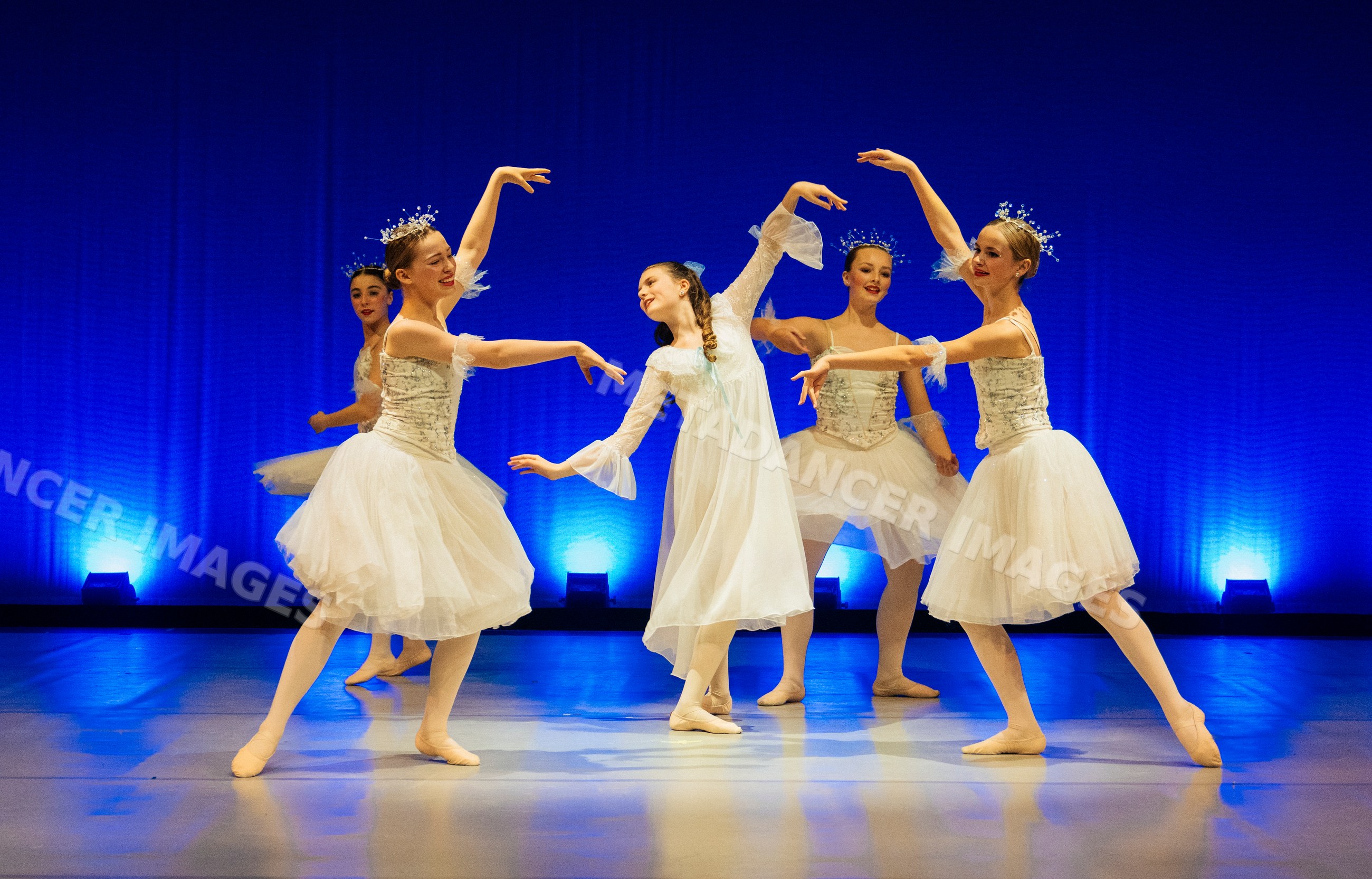 Five female ballet dancers perform