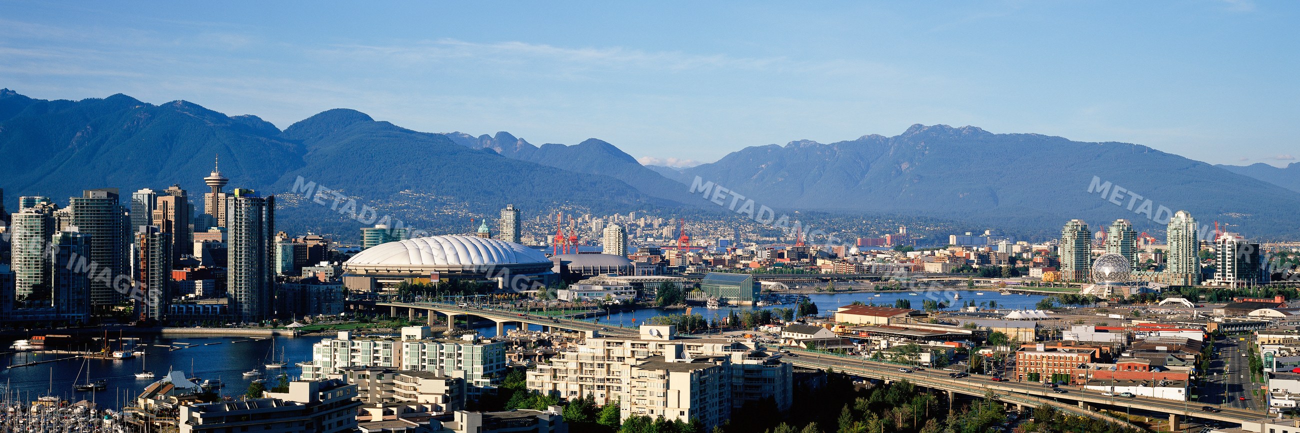 Vancouver skyline with mountains and harbor, canada