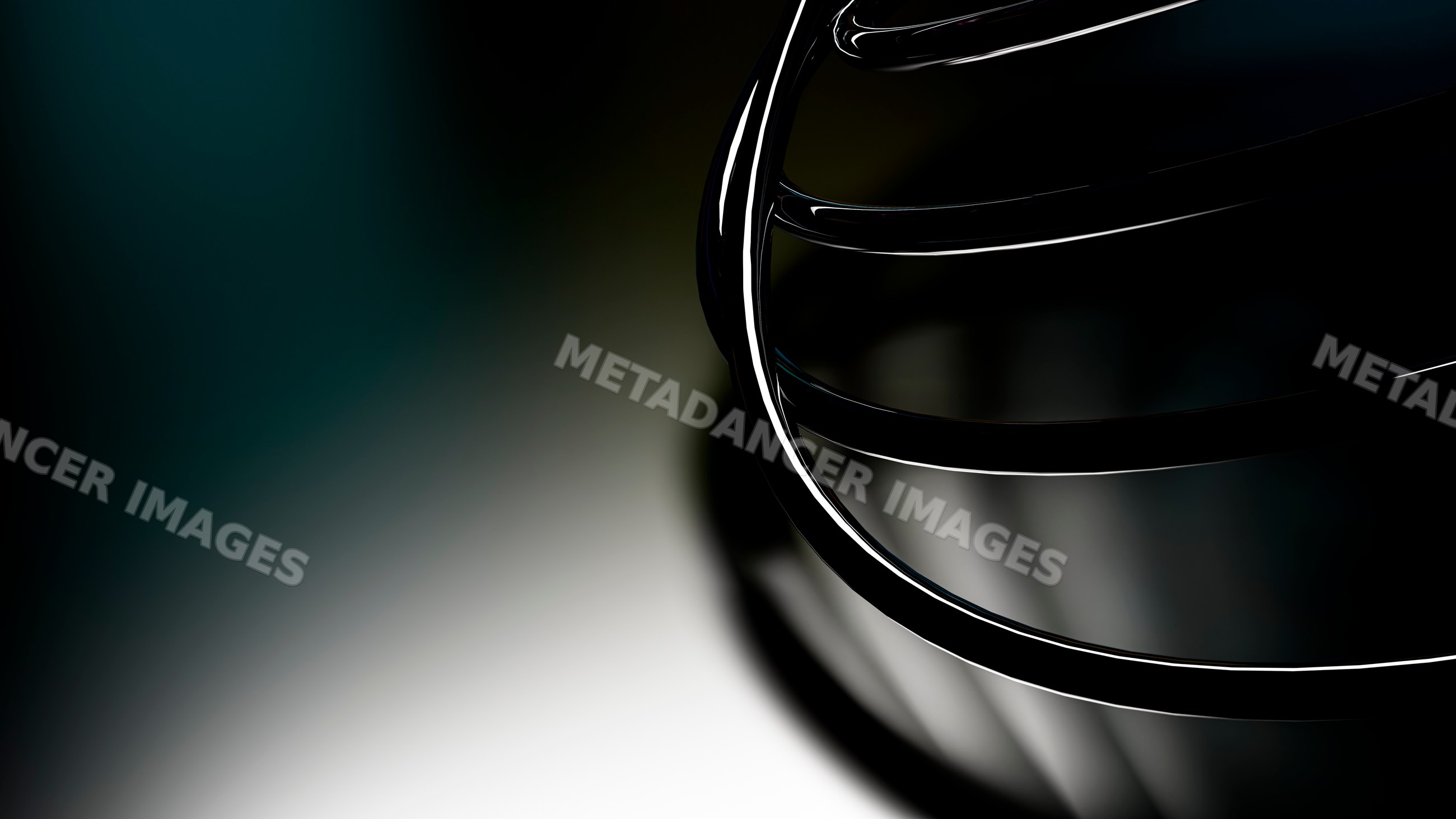 Metal whisk utensil with wire loops on dark background