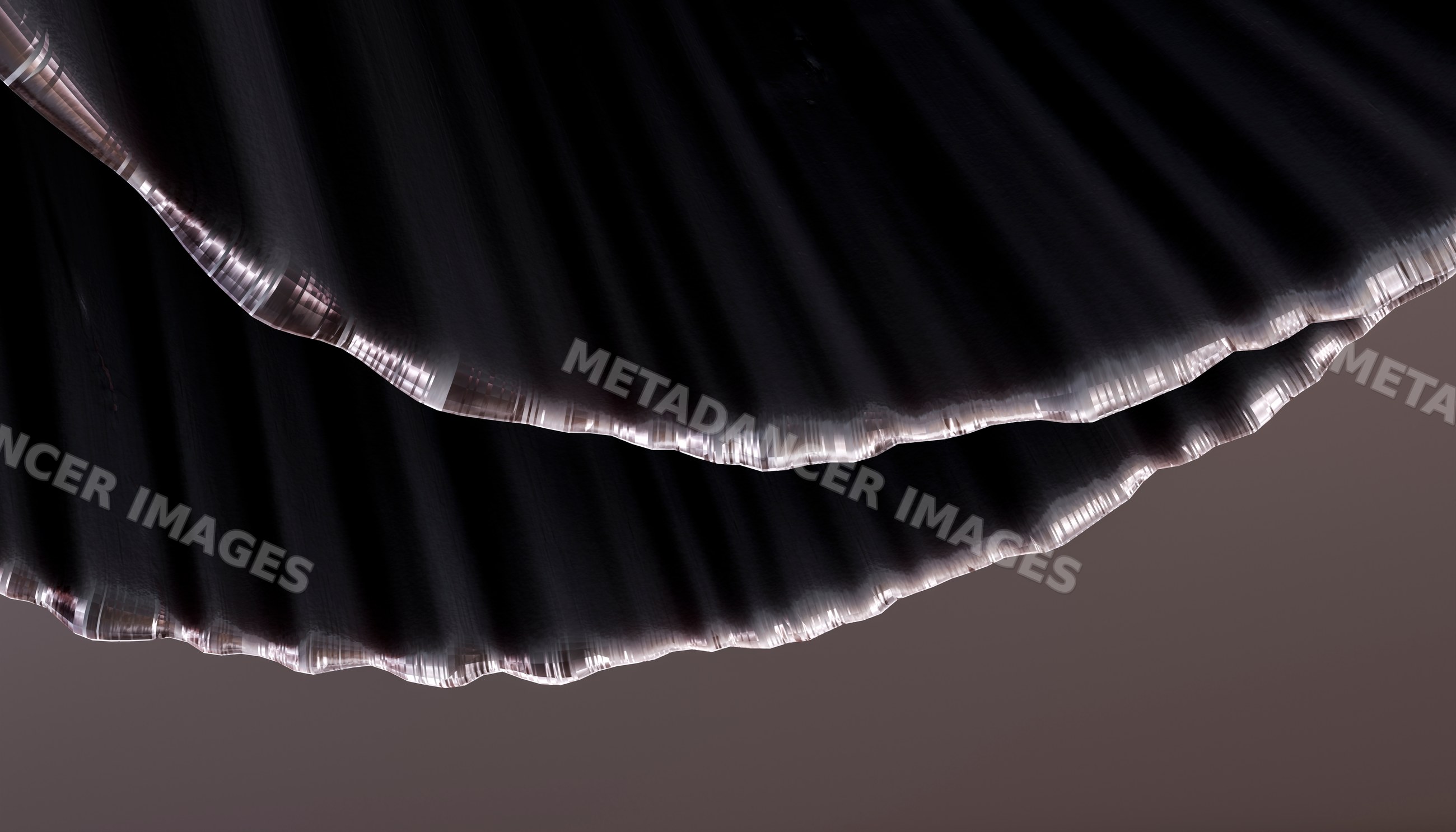 Close-up view of dark folded fabric