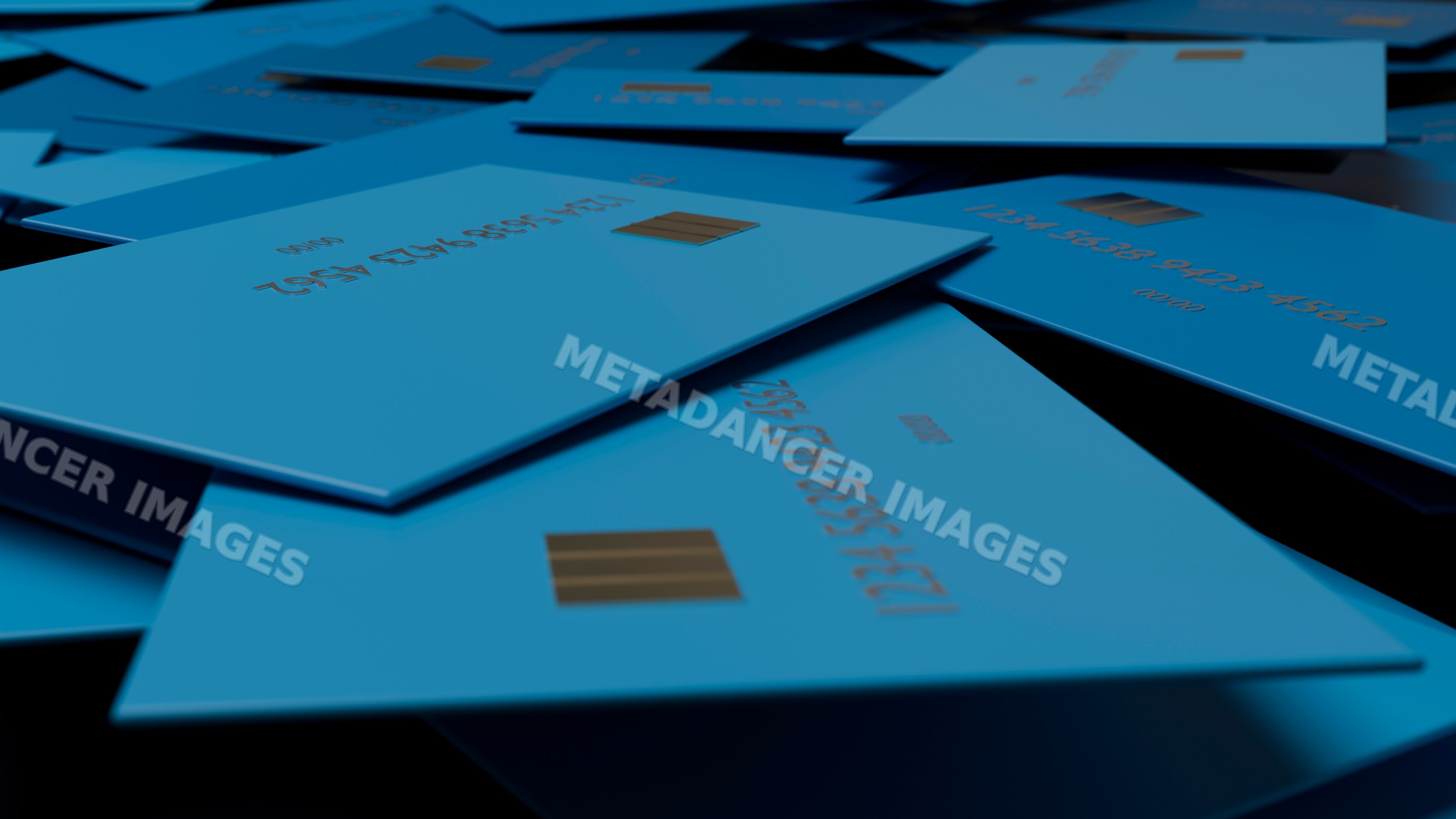 Multiple blue credit cards with emv chips spread out for payment