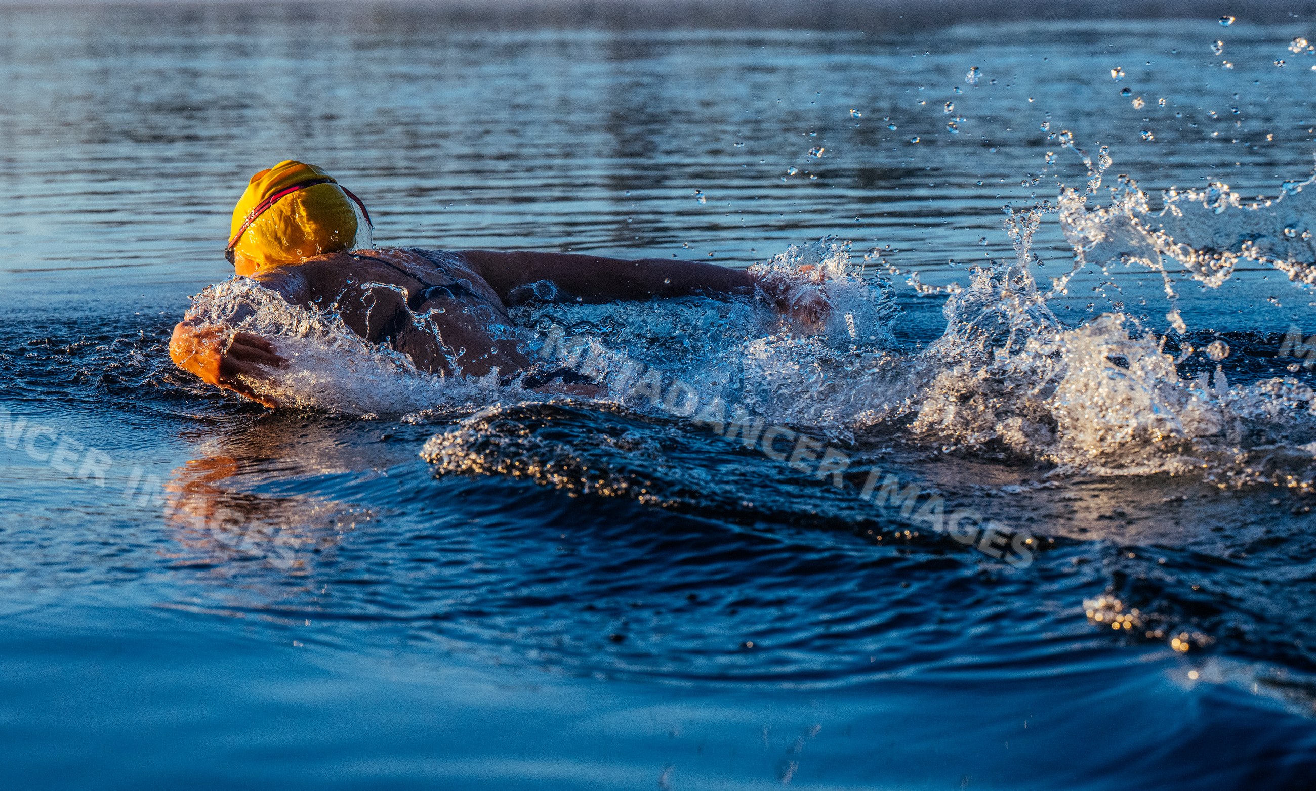 Open water white swimmer swimming outdoors