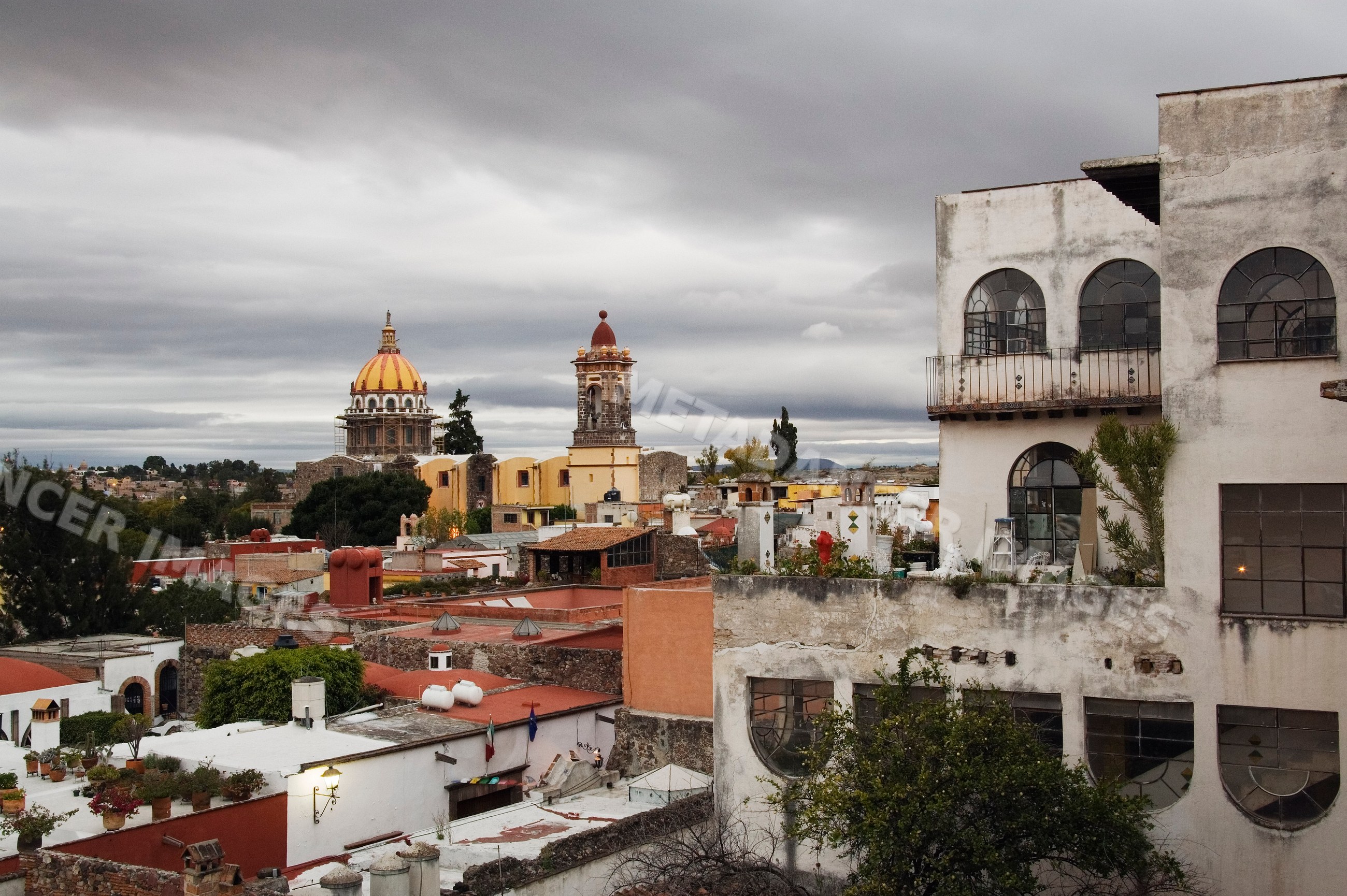 San miguel de allende cityscape with striped church dome and urban