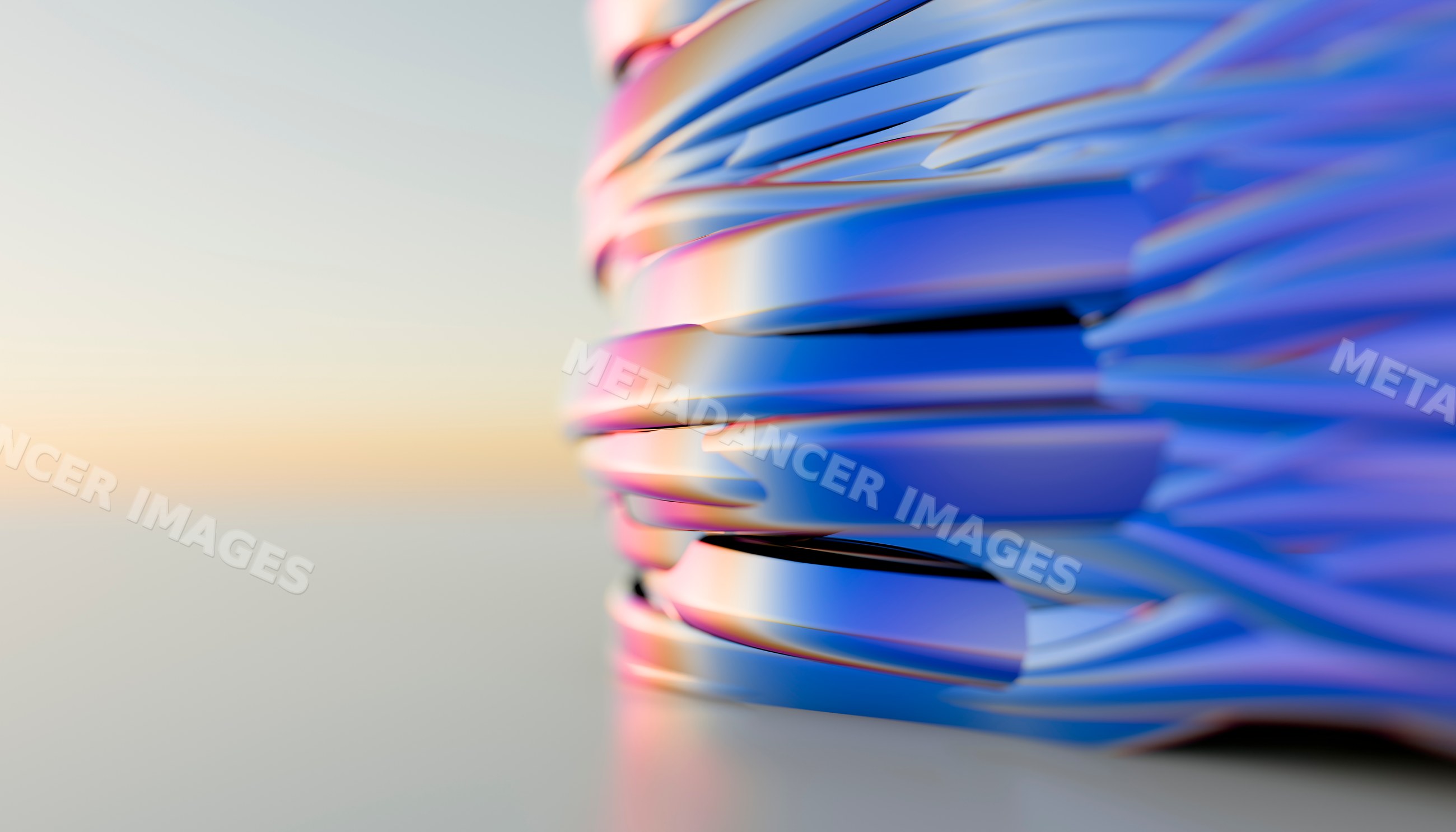 Abstract sculpture with reflective blue and pink curved shapes