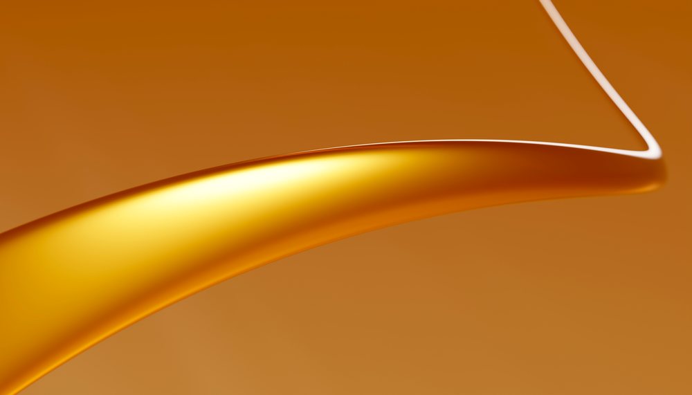 Abstract golden liquid metal curve with smooth reflective surface
