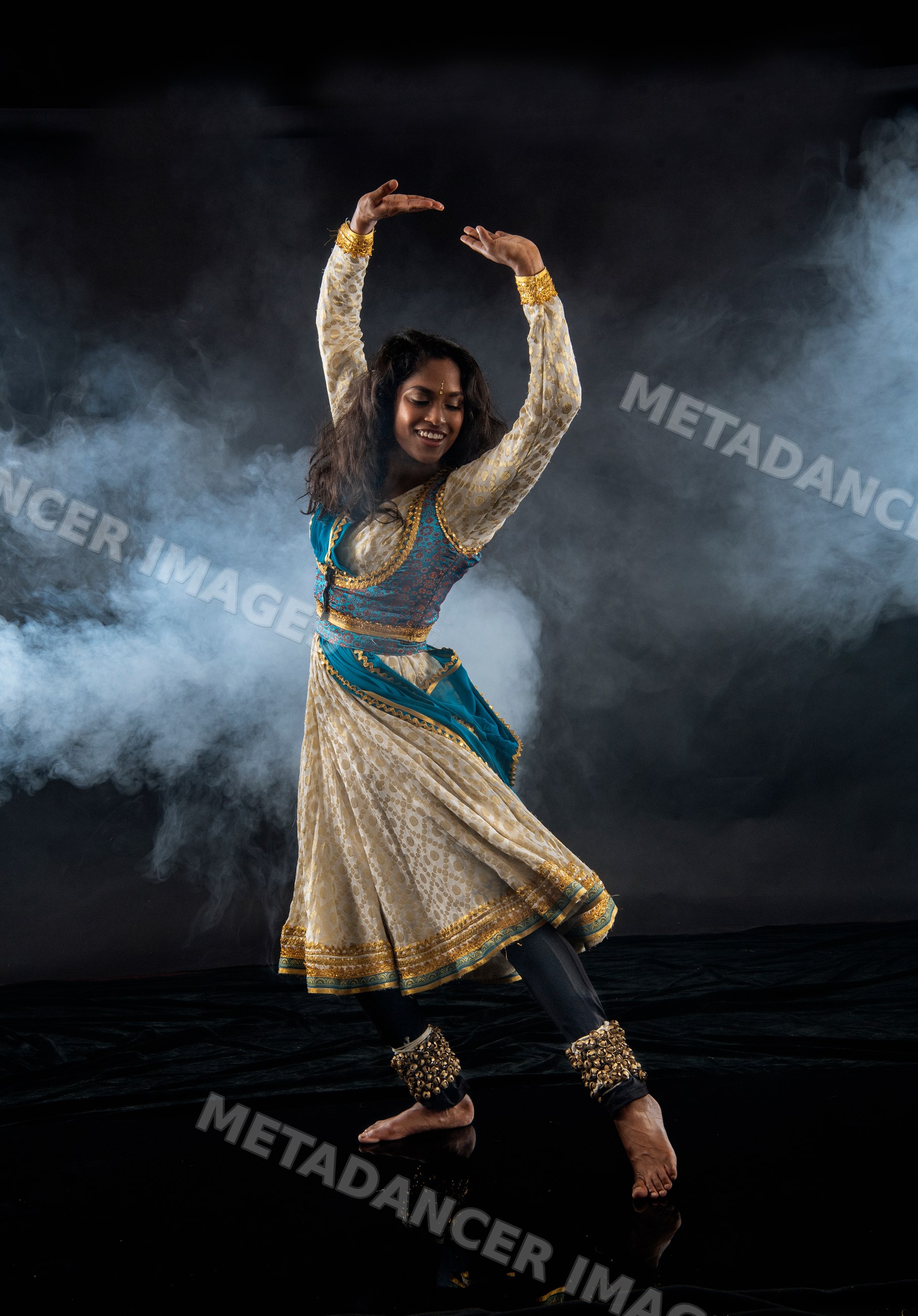 South Asian female dancer performing indian classical dance