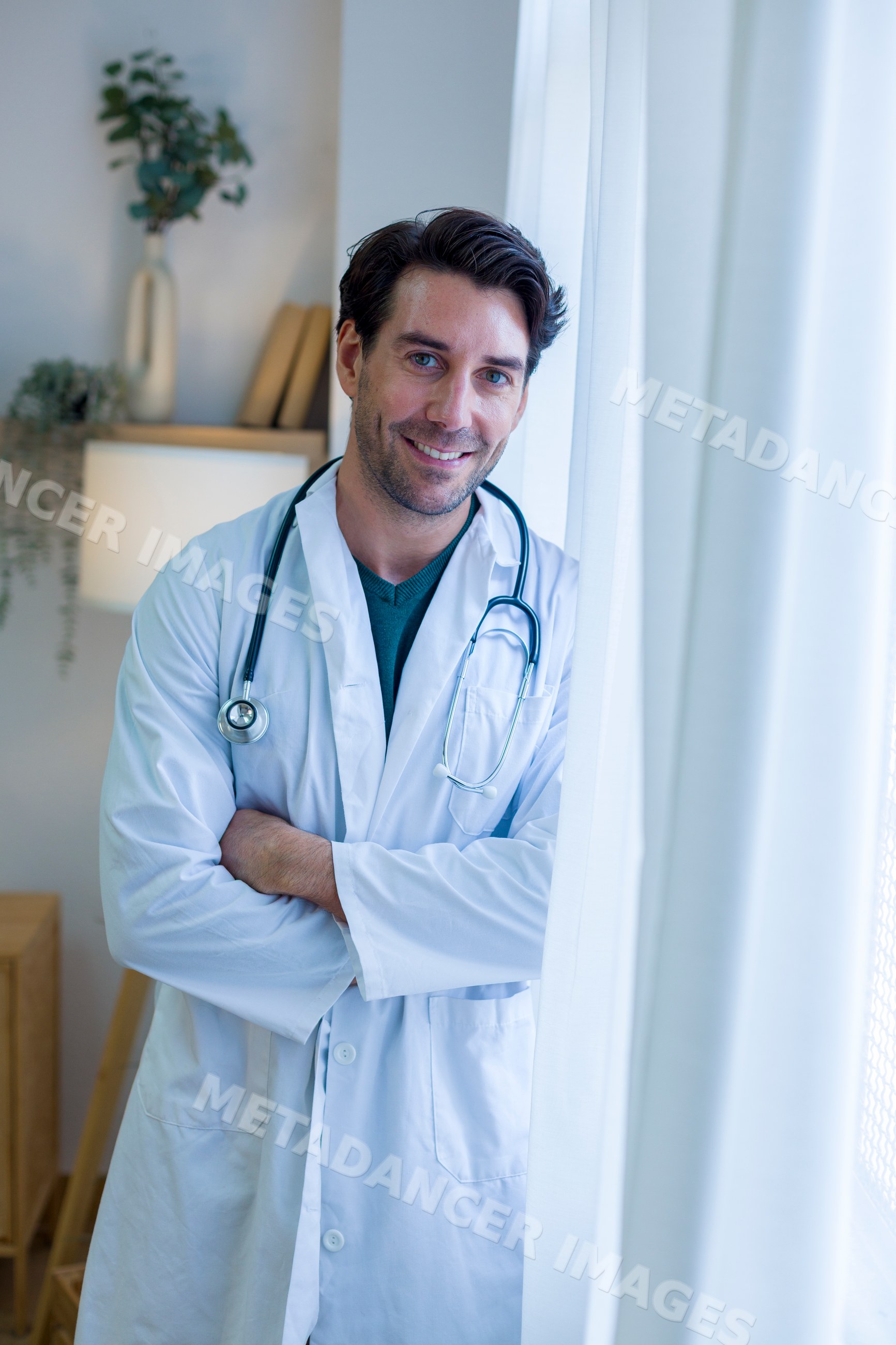 Doctor smiling inside a home medical setting