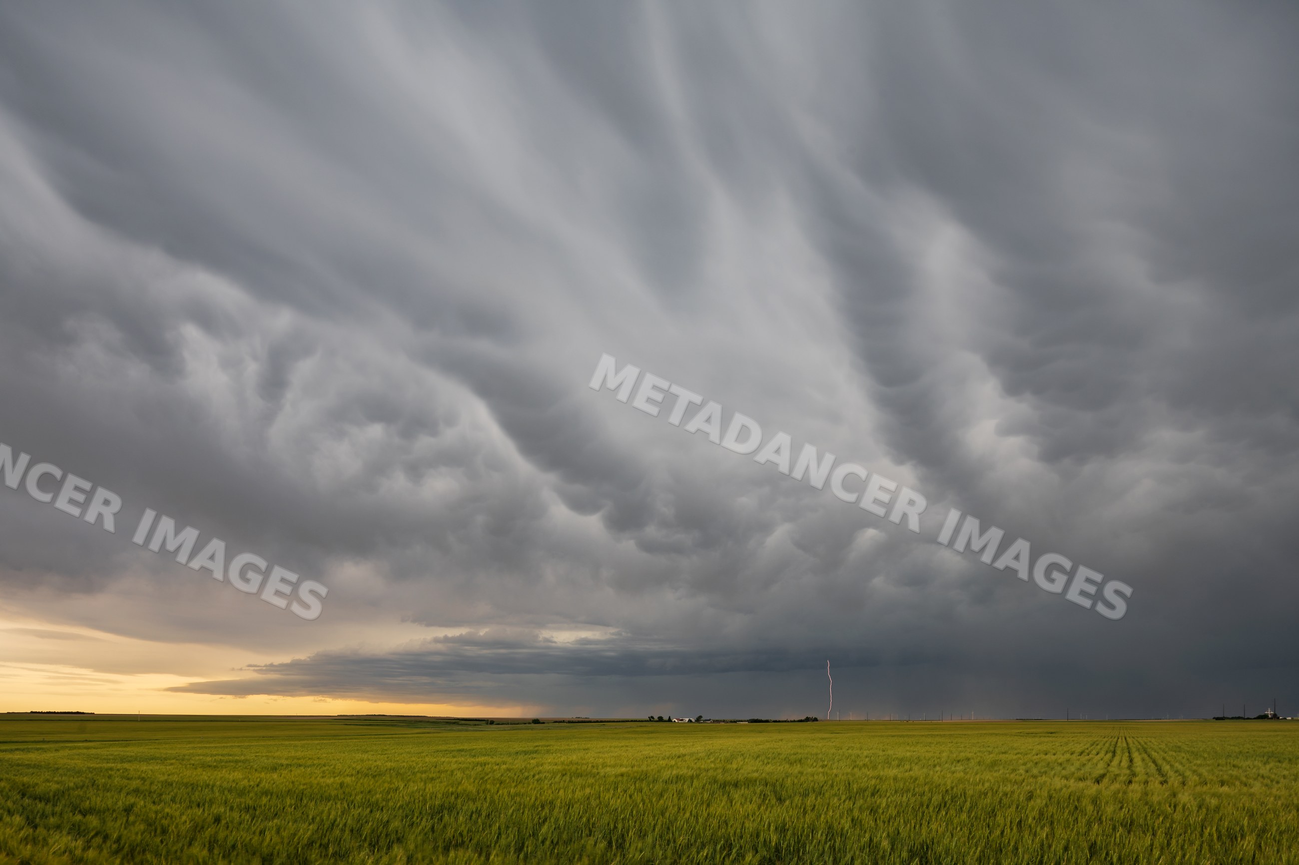 Supercell storm with lightning over fields in fleming, colorado