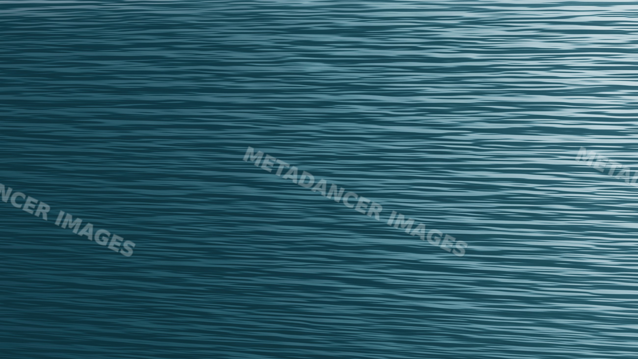 Ocean water surface with gentle waves and ripples