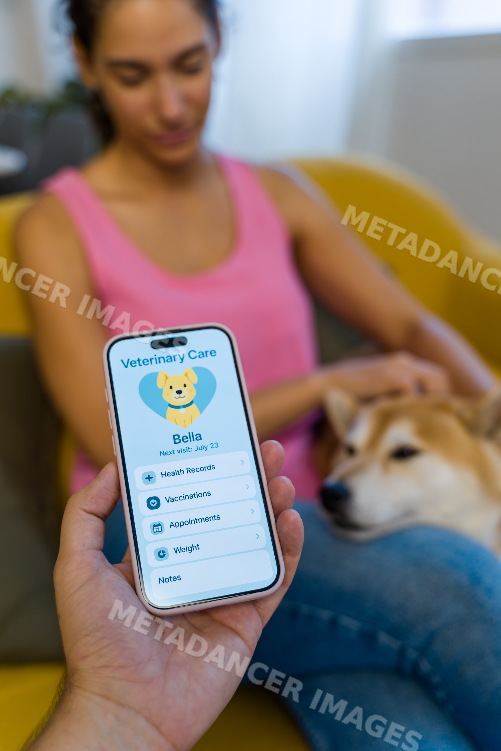 A smartphone displays a veterinary care application as a Hispanic