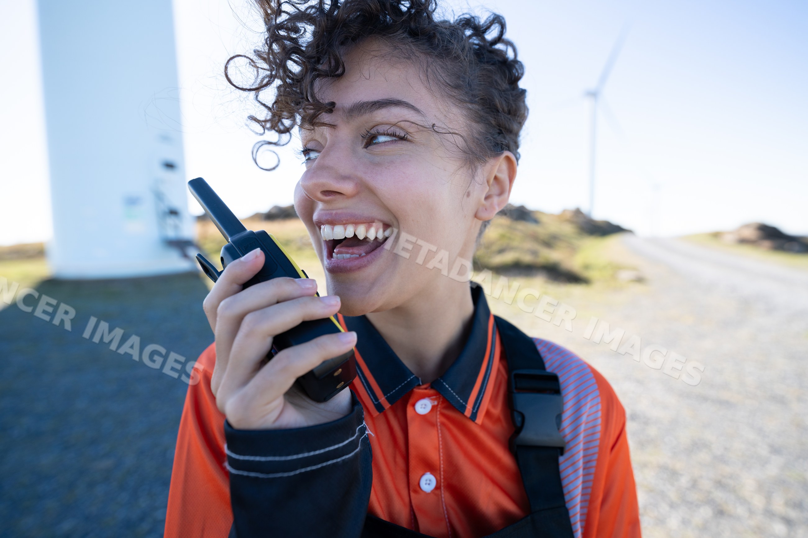 White woman communicating with walkie-talkie