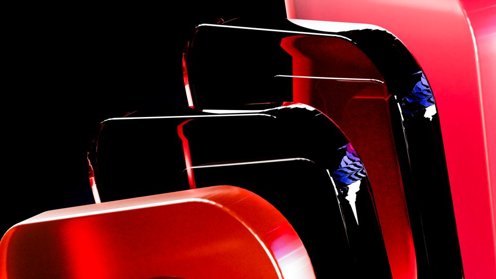 Modern abstract red and black glossy sculptures with curved shapes