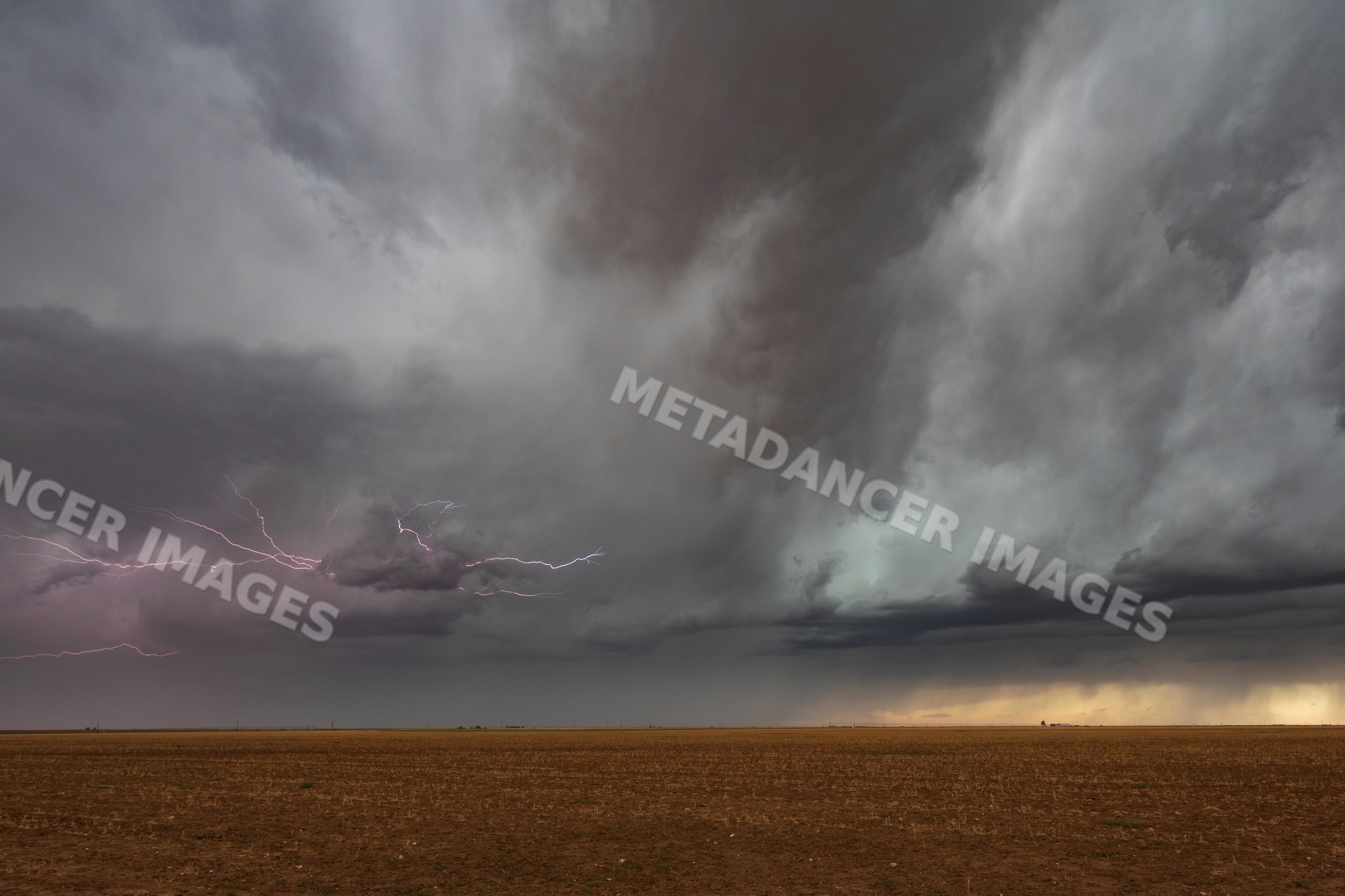 Lightning striking during storm over open field in floydada, texas