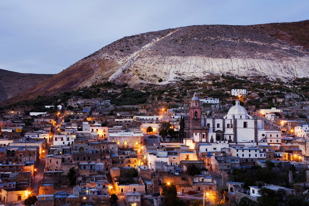 Evening view of real de catorce town with illuminated hillside