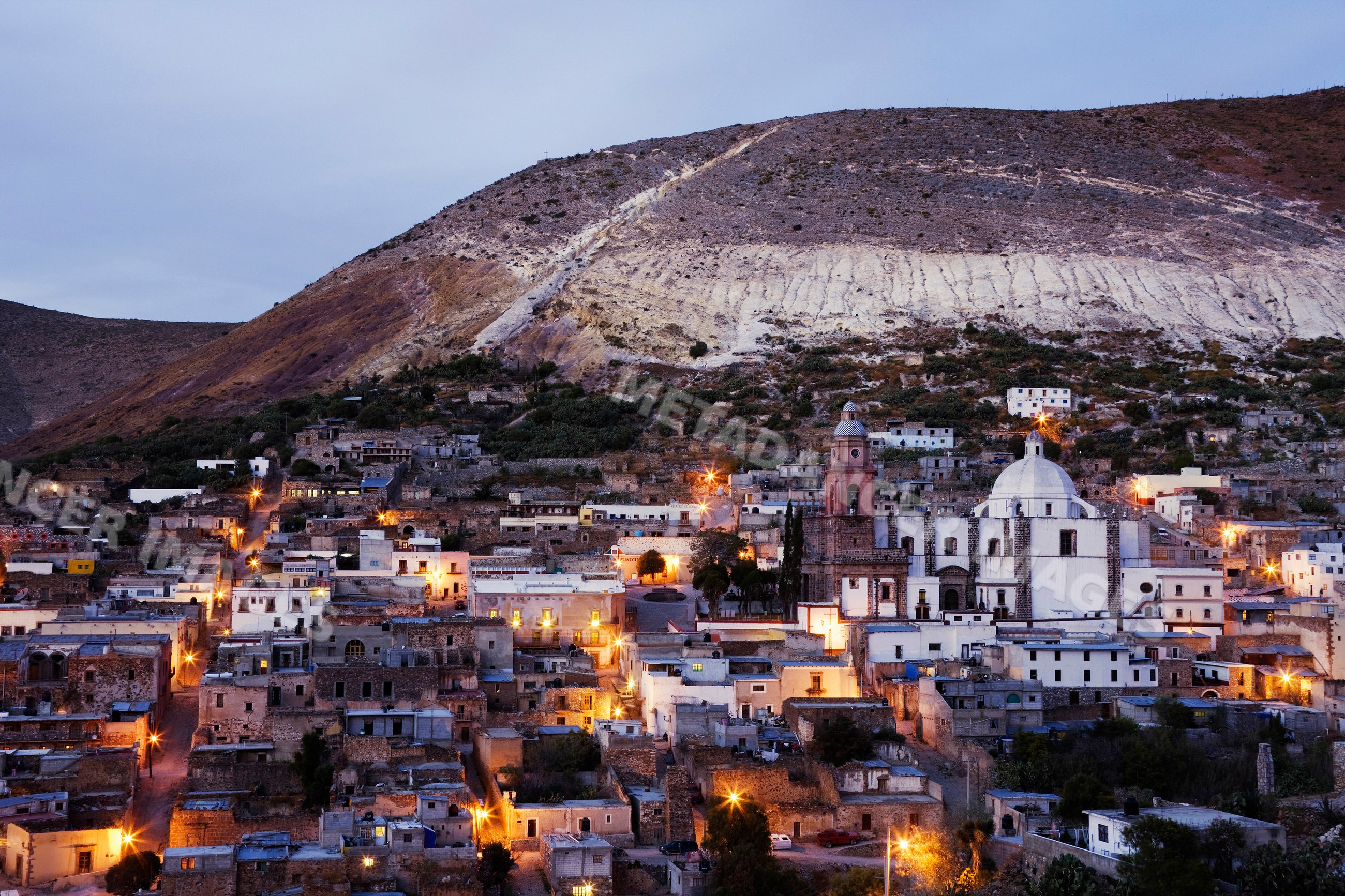 Evening view of real de catorce town with illuminated hillside
