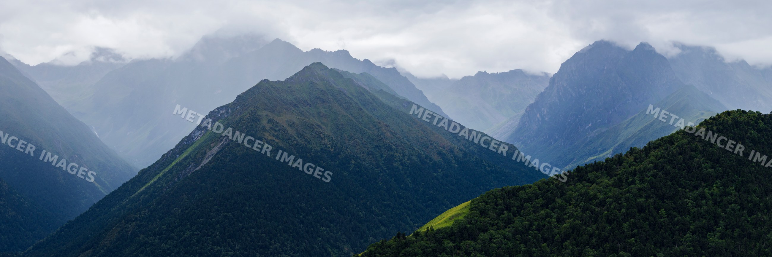 Belang Mountains with forested slopes