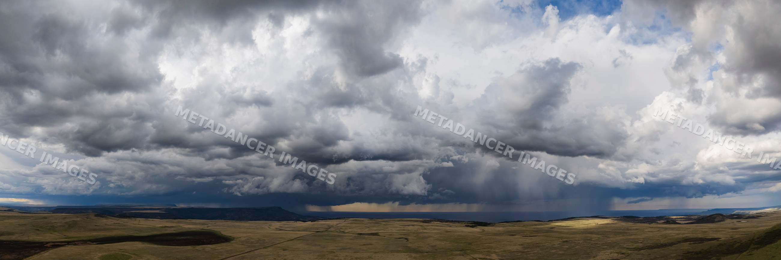 Storm clouds and rain over johnson mesa