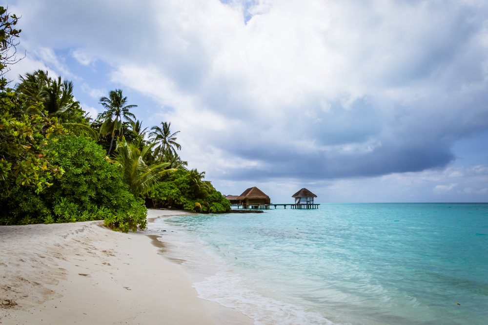 Tropical beach with overwater bungalows in a beach
