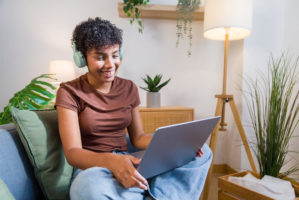 Young African American woman using laptop