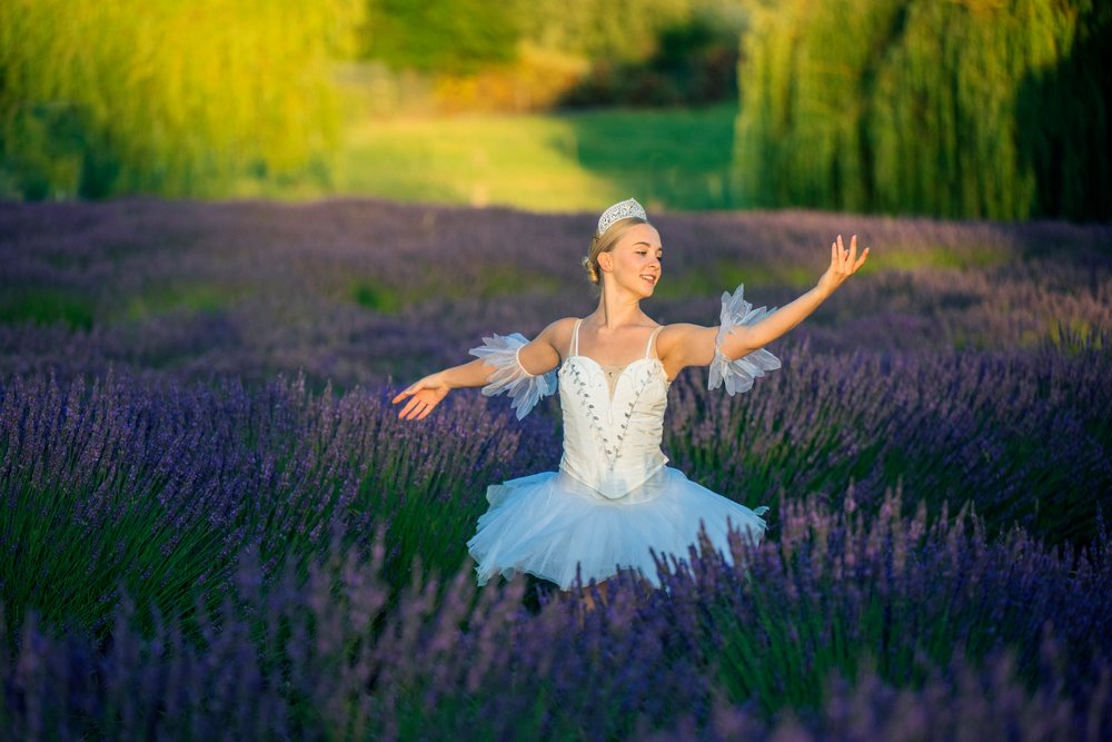 A ballet white dancer poses gracefully in a lavender field in WA, USA